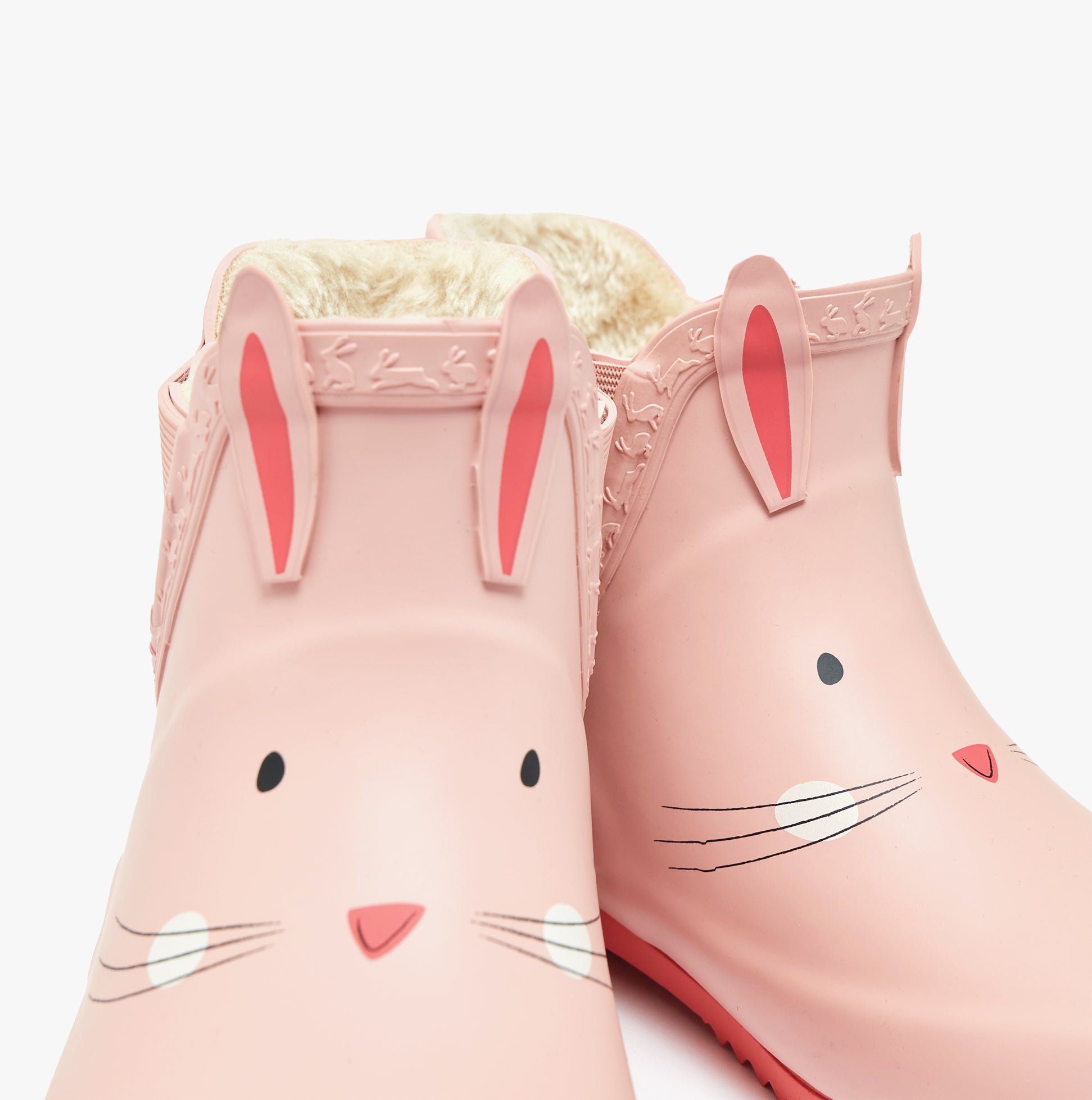Joules RAINDANCE Girls Wellies Bunny detail view showing pink rubber wellies with bunny design and fleece lining.
