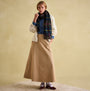 Joules LANGTREE Womens Scarf Navy Check worn by a model, styled with a cream cardigan and beige skirt, front view.