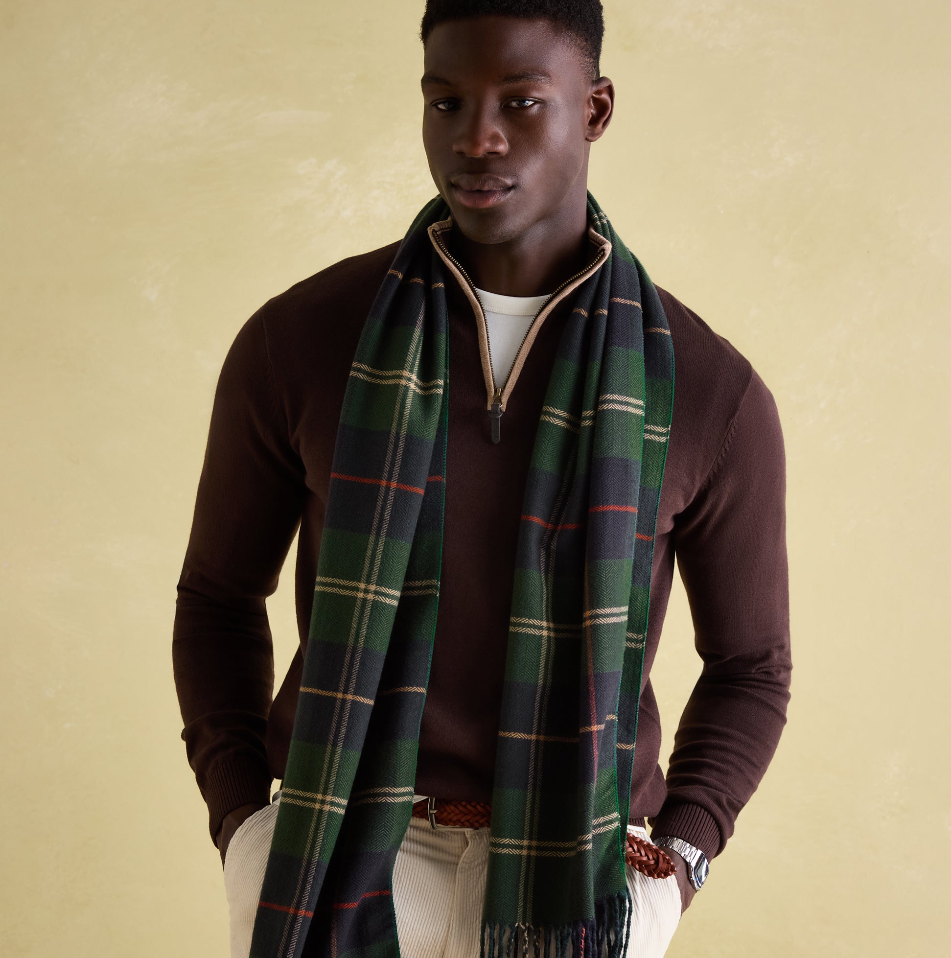 Joules MENS LANGTREE Mens Scarf Navy Check draped elegantly over a model, showcasing the checked pattern and tasselled ends.