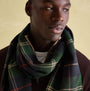 Joules MENS LANGTREE Mens Scarf Navy Check worn elegantly by a model, showcasing the checked pattern and tasselled ends.