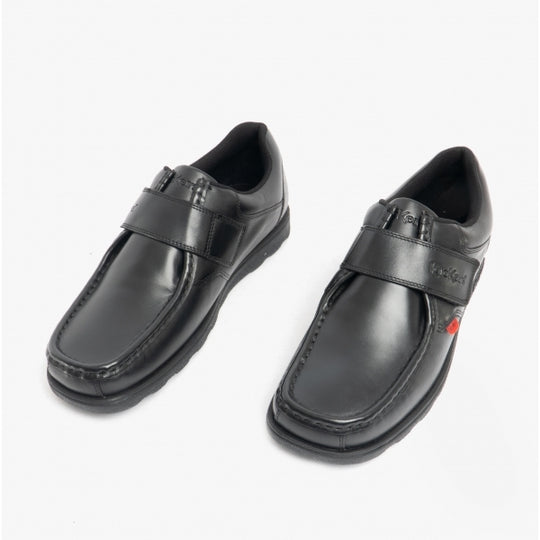 Kickers 114226 FRAGMA STRAP Boys School Shoes Black side view with touch fasten strap, leather upper, and rubber sole.