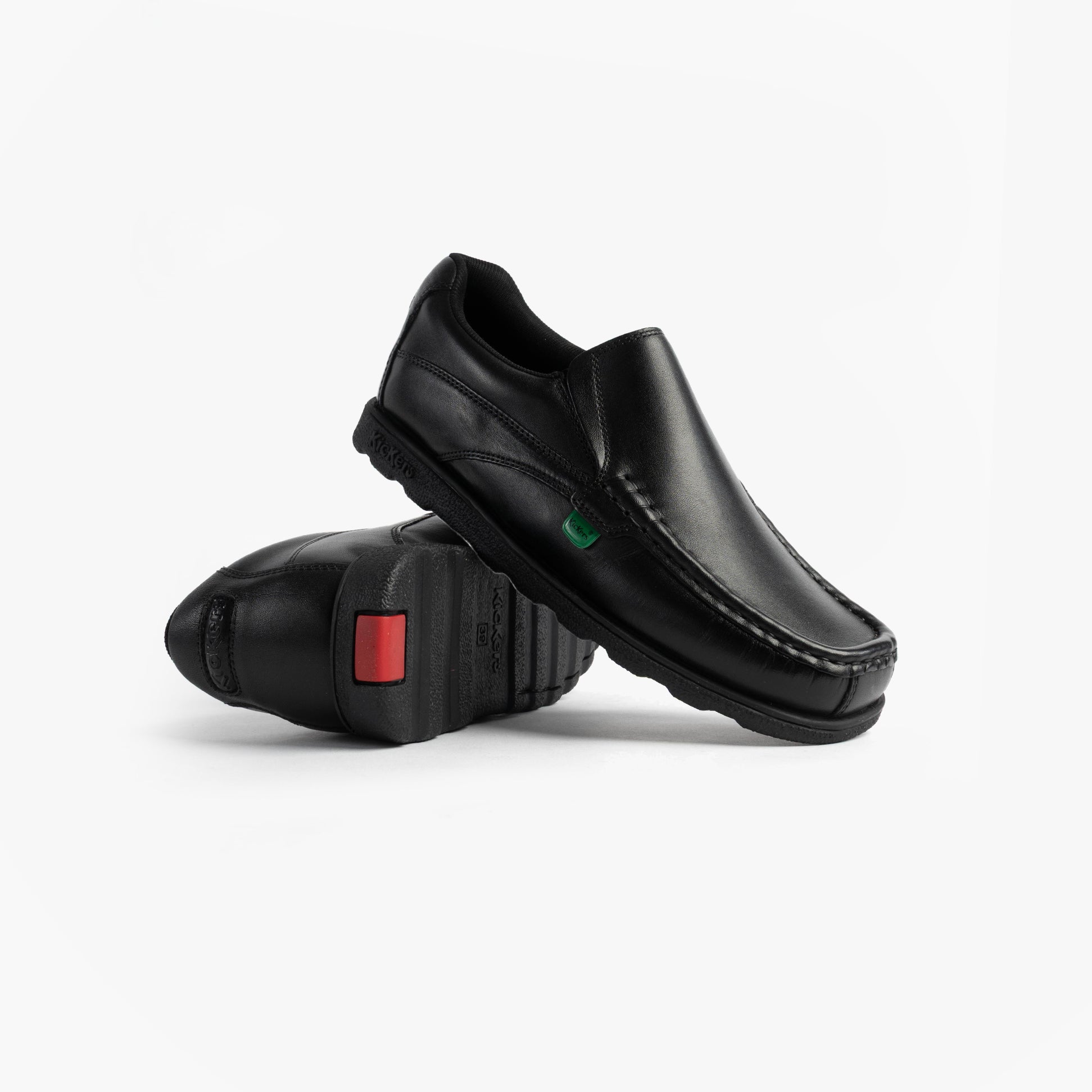 Kickers 114245 FRAGMA SLIP Boys School Shoes Black side view showcasing leather upper and rubber sole.