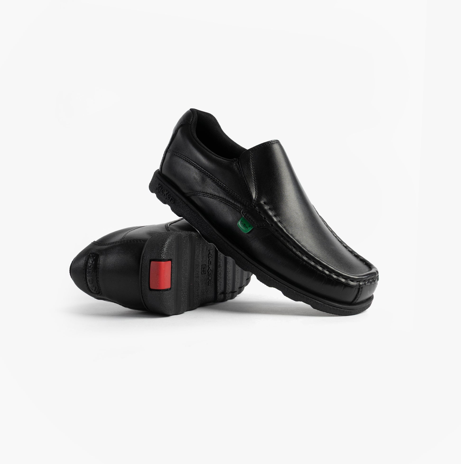 Kickers 114245 FRAGMA SLIP Boys School Shoes Black side view showcasing leather upper and rubber sole.