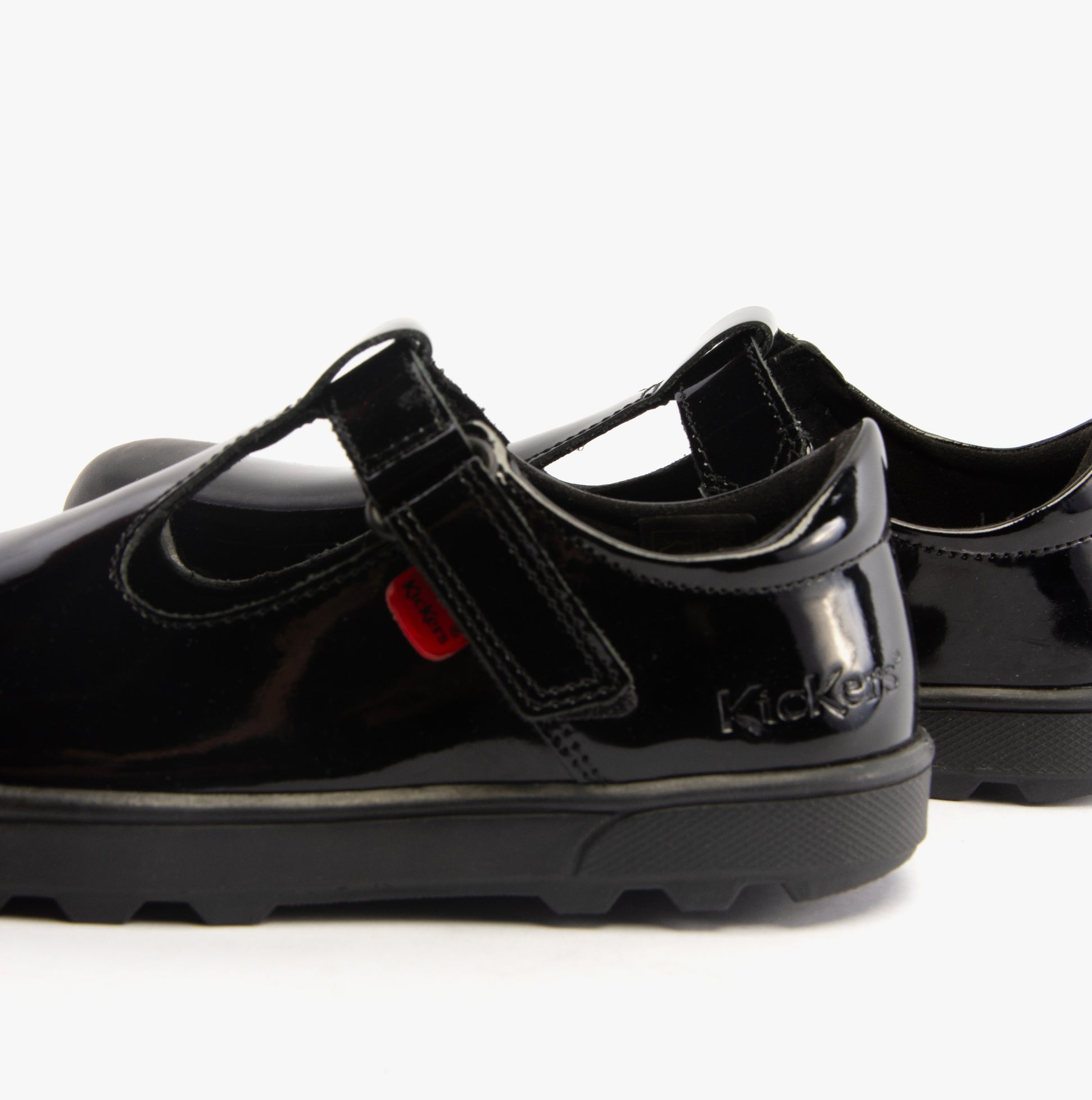 Kickers 116227 PLUNK MJ Girls School Shoes Black Patent side view showing shiny patent finish and touch fastening strap.