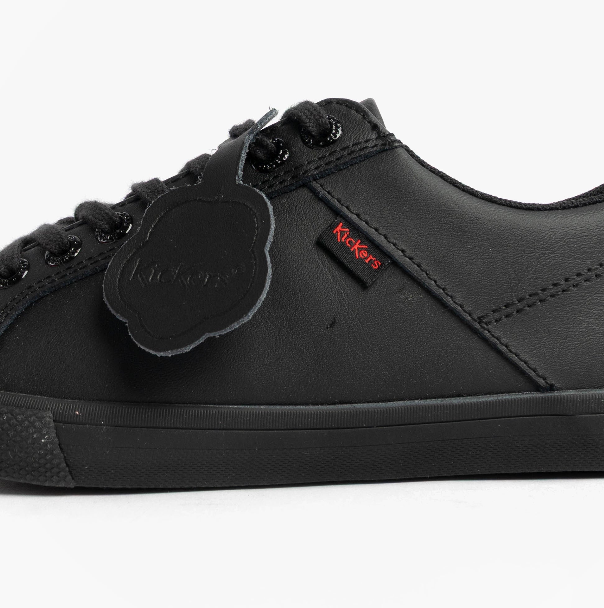 Kickers 116408 KODY LO Unisex School Shoes Black side view, leather upper, lace-up closure, flat sole.