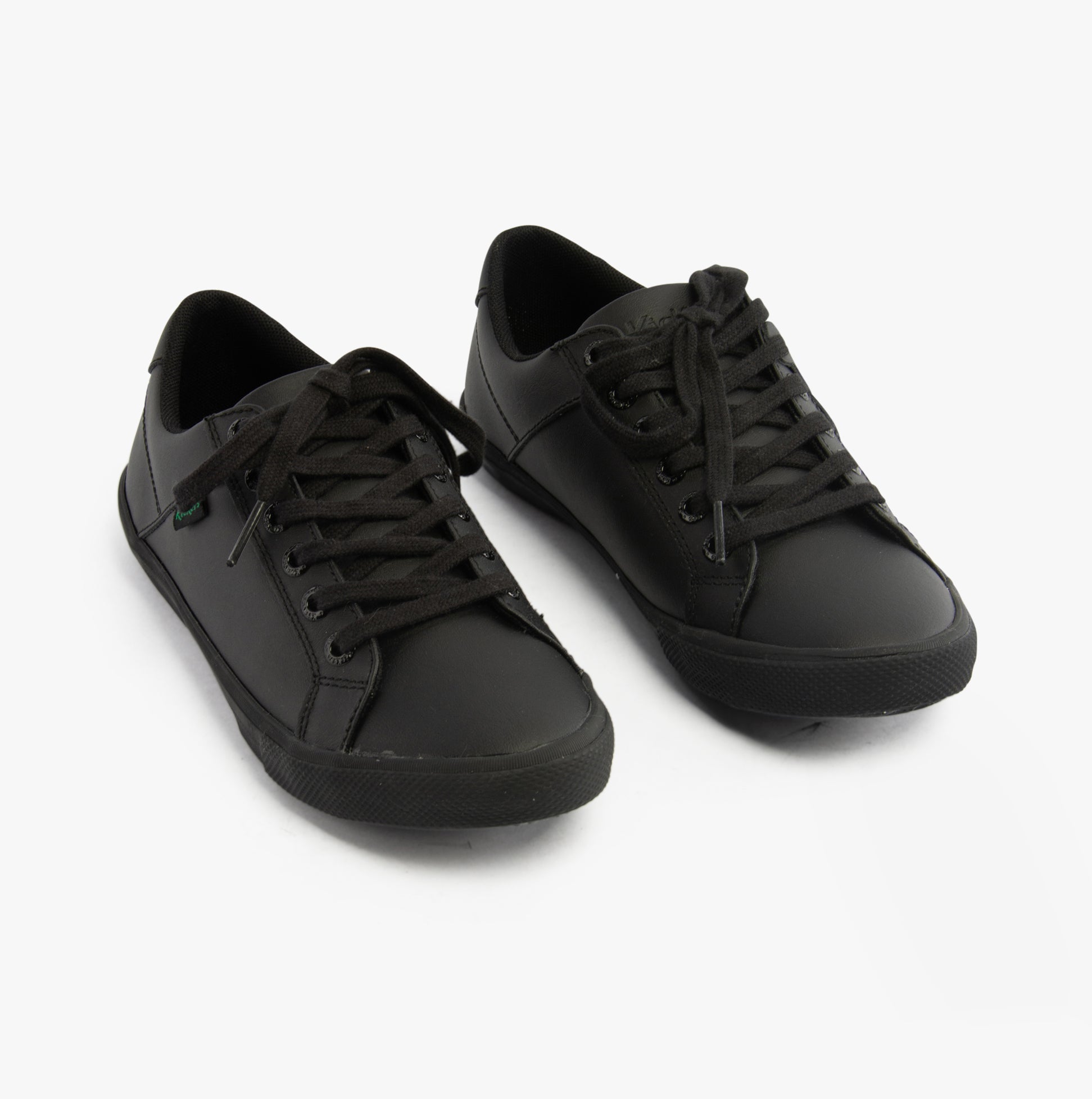 Kickers 116407 KODY LO Unisex School Shoes Black side view, lace-up leather upper, flat rubber sole, breathable comfort.