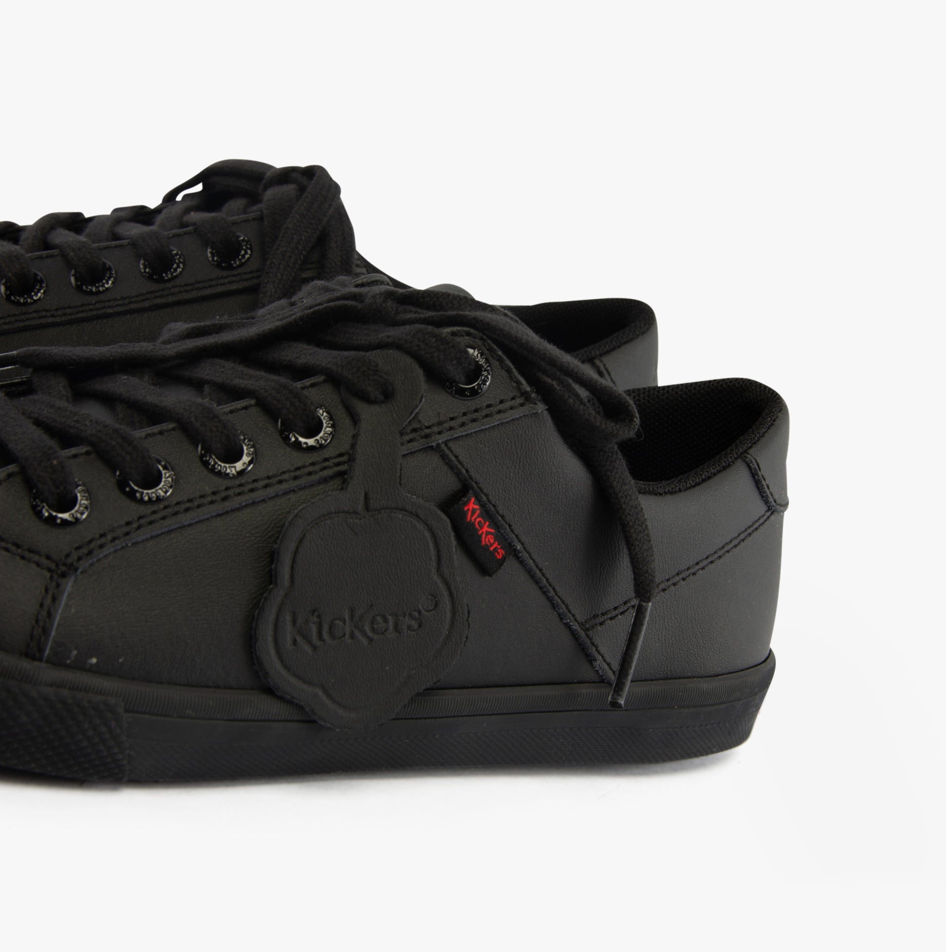 Kickers 116407 KODY LO Unisex School Shoes Black side view showcasing black leather upper and lace-up design.