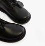 Kickers 117217 KOPI DERBY Boys School Shoes Black close-up view showcasing the shiny leather upper and lace-up design.