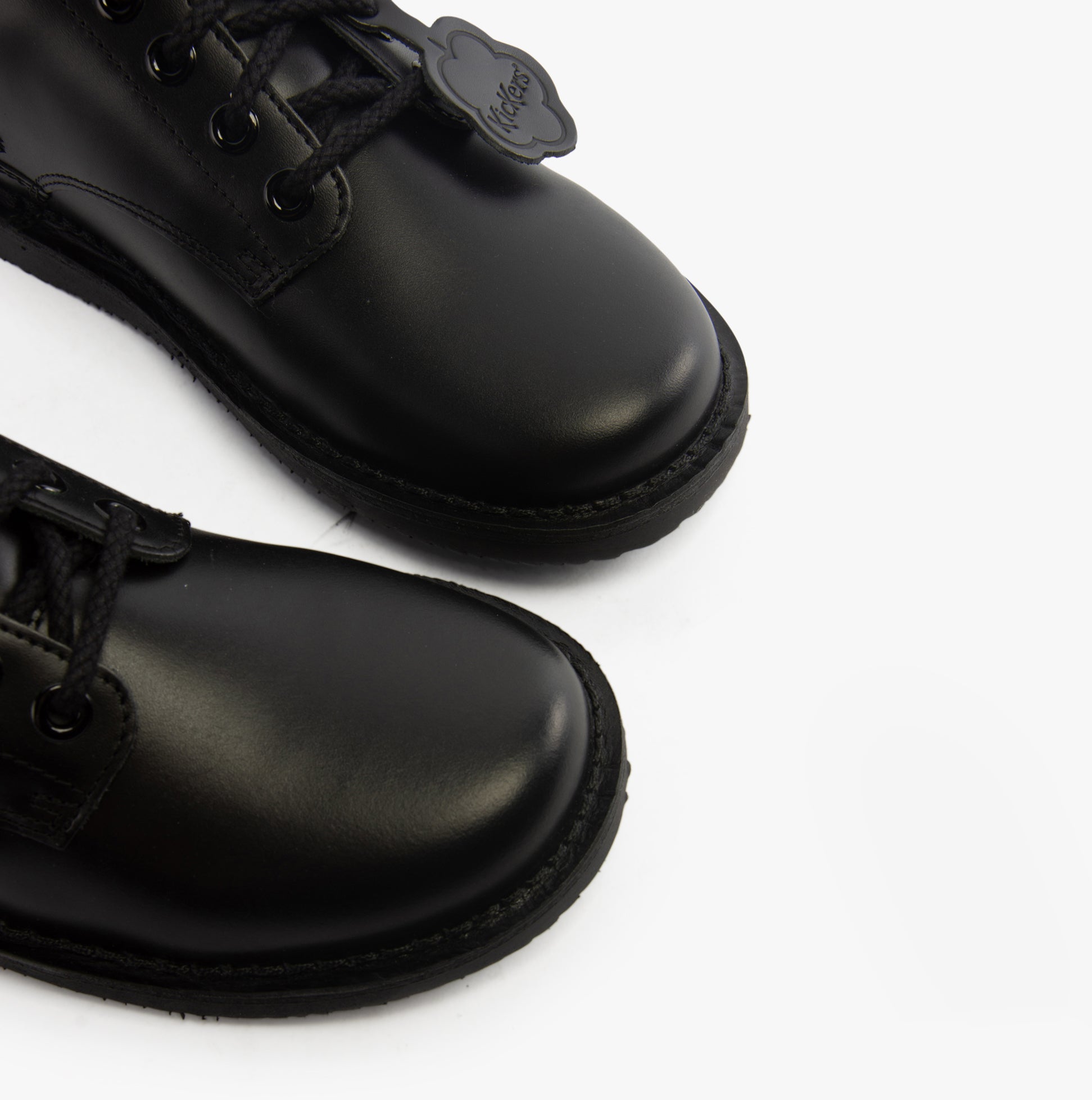 Kickers 117217 KOPI DERBY Boys School Shoes Black close-up view showcasing the shiny leather upper and lace-up design.