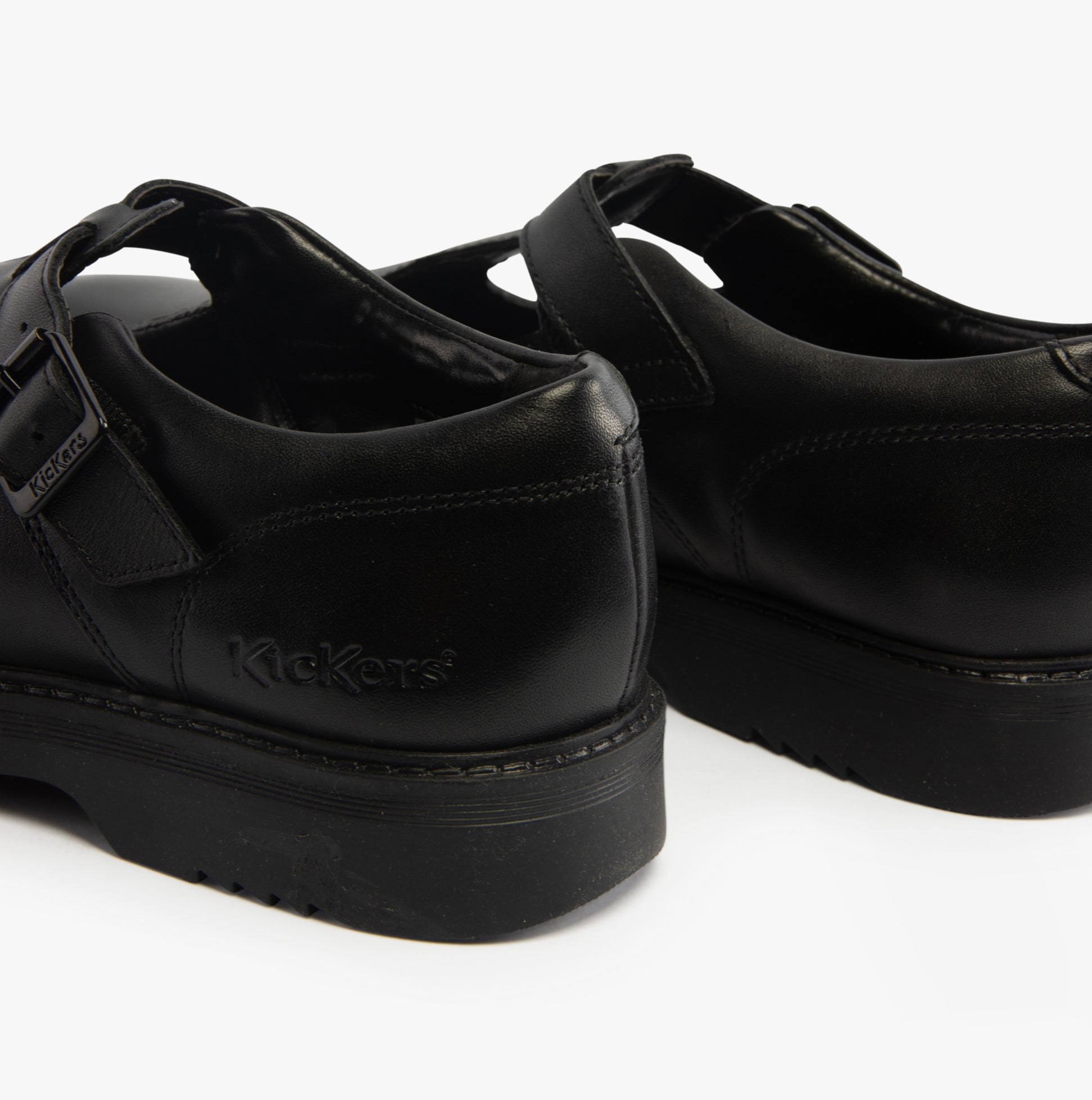 Kickers 117220 FINLEY T BAR Girls School Shoes Black rear view showcasing leather upper and flat sole.