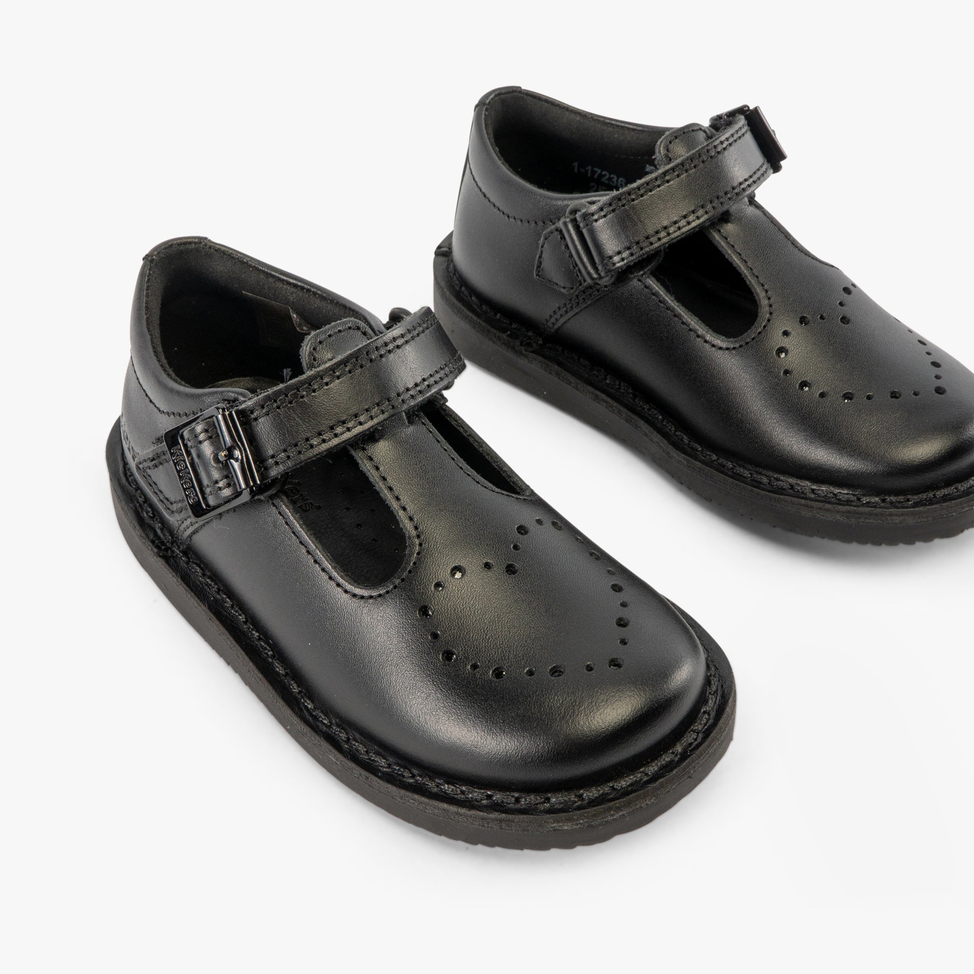 Kickers 117236 KOPI HEART T BAR Infant Girls School Shoes Black side view showing the sleek black leather upper and buckle closure.