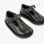 Kickers 117236 KOPI HEART T BAR Infant Girls School Shoes Black side view showing the sleek black leather upper and buckle closure.