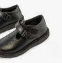 Kickers 117236 KOPI HEART T BAR Infant Girls School Shoes Black side view showcasing buckle and round toe design.