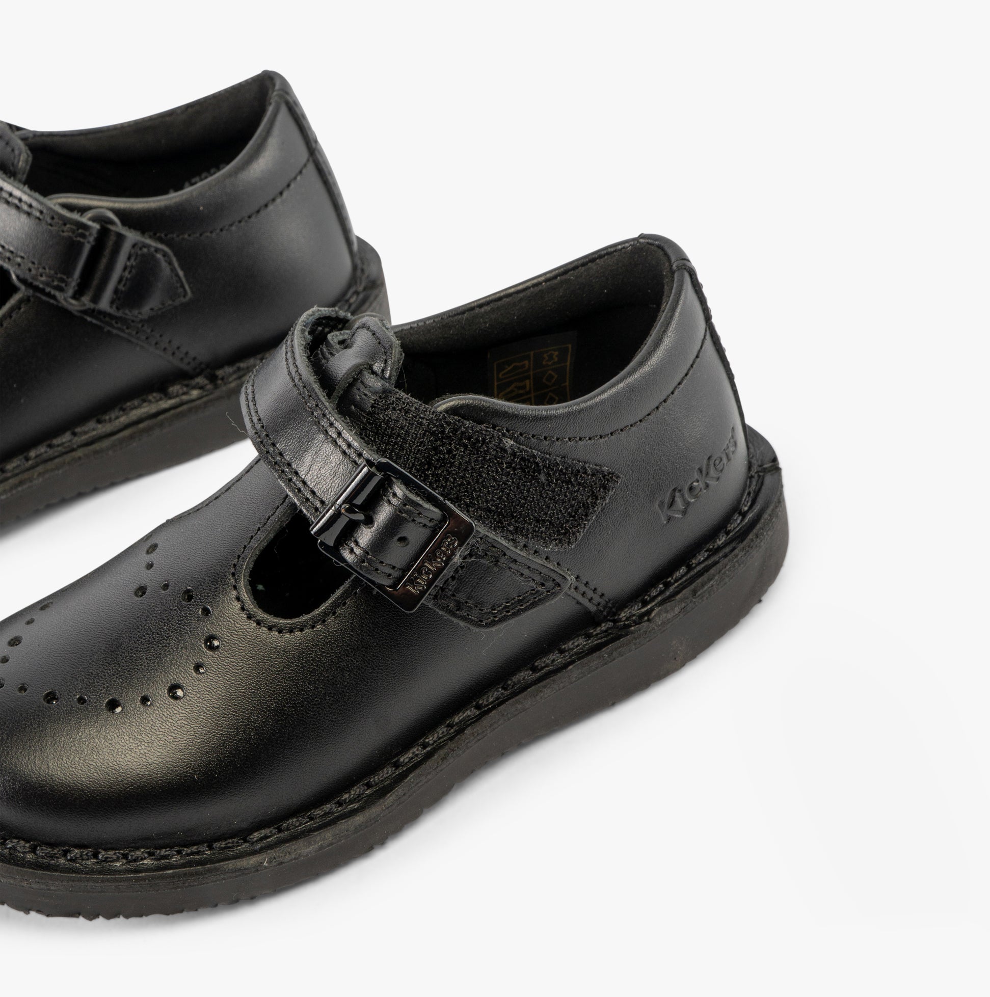 Kickers 117236 KOPI HEART T BAR Infant Girls School Shoes Black side view showcasing buckle and round toe design.