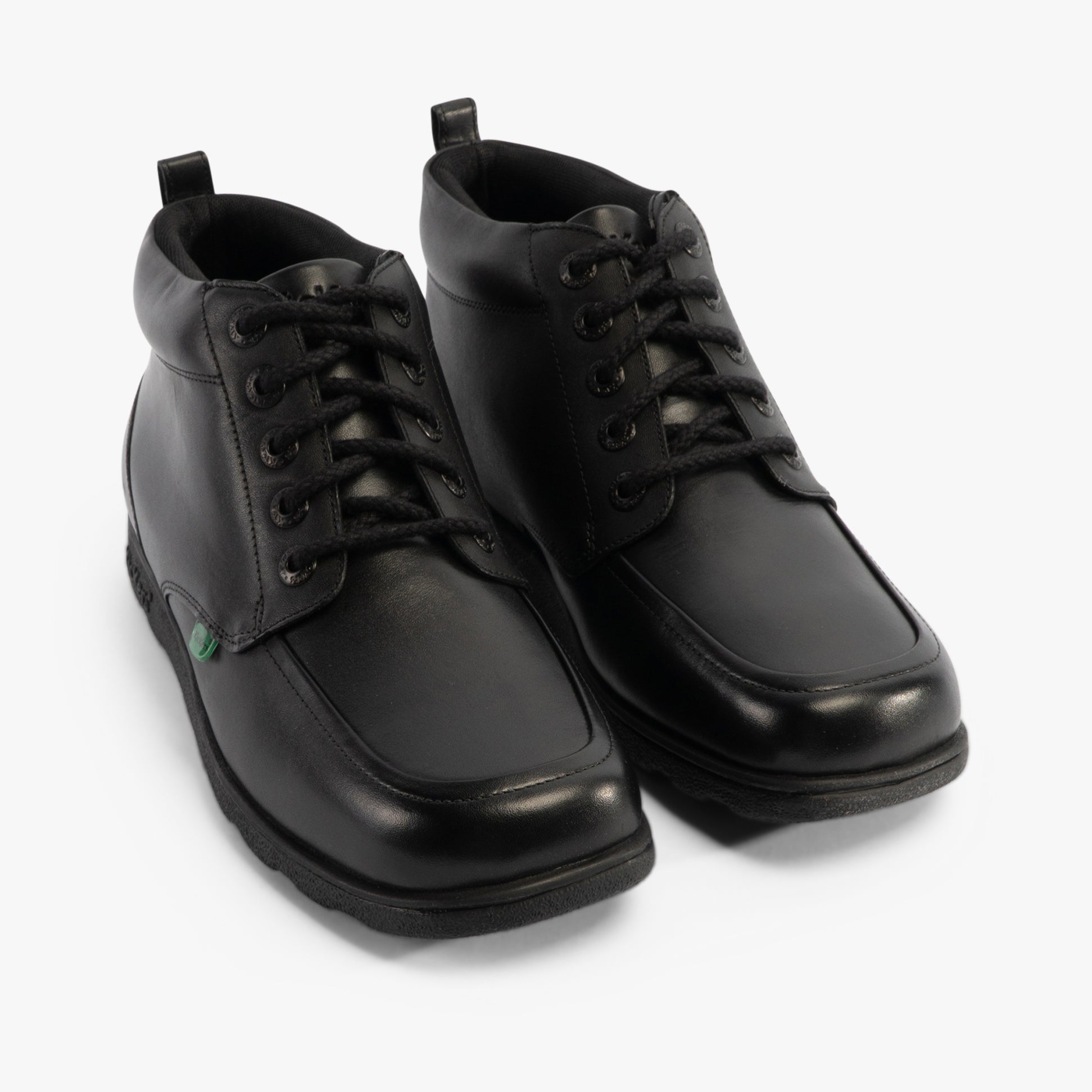 Kickers 117606 FRAGMA CHUK Boys School Boots Black front view featuring lace-up design and leather upper.