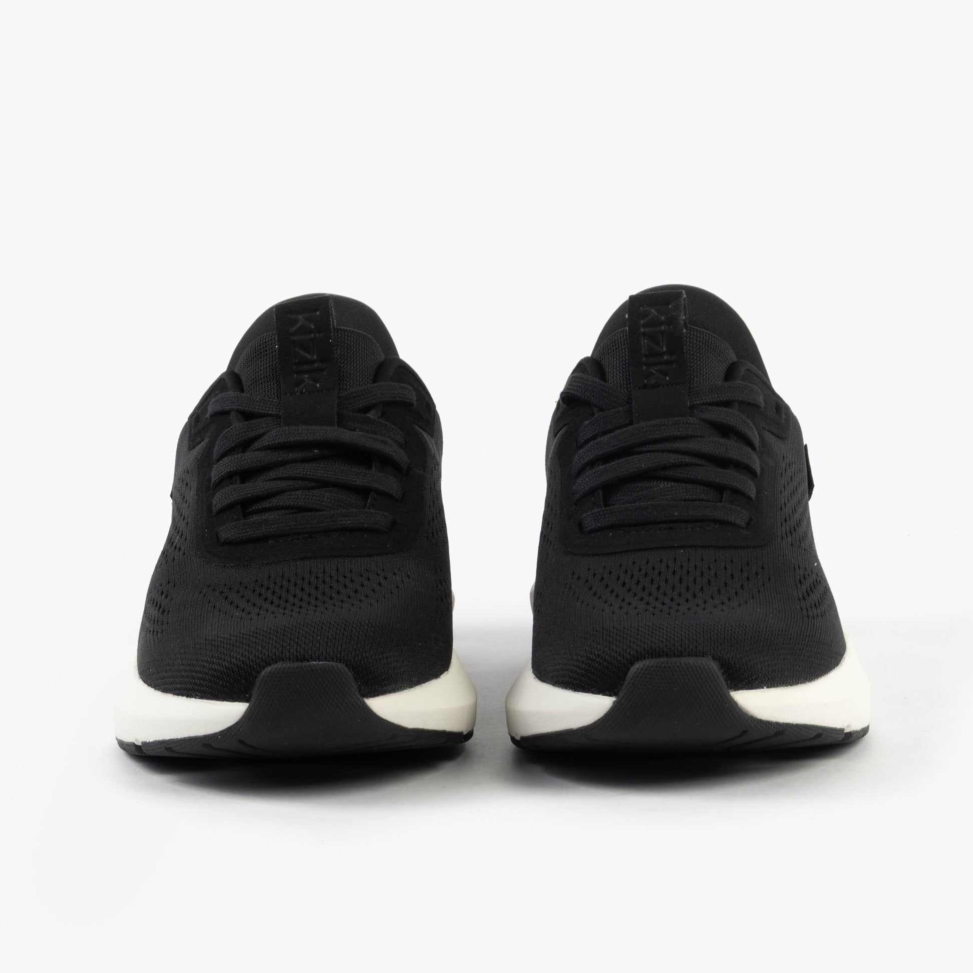 Kizik ATHENS 2.0 Womens Trainers Black front view showing lace-up design and round toe.