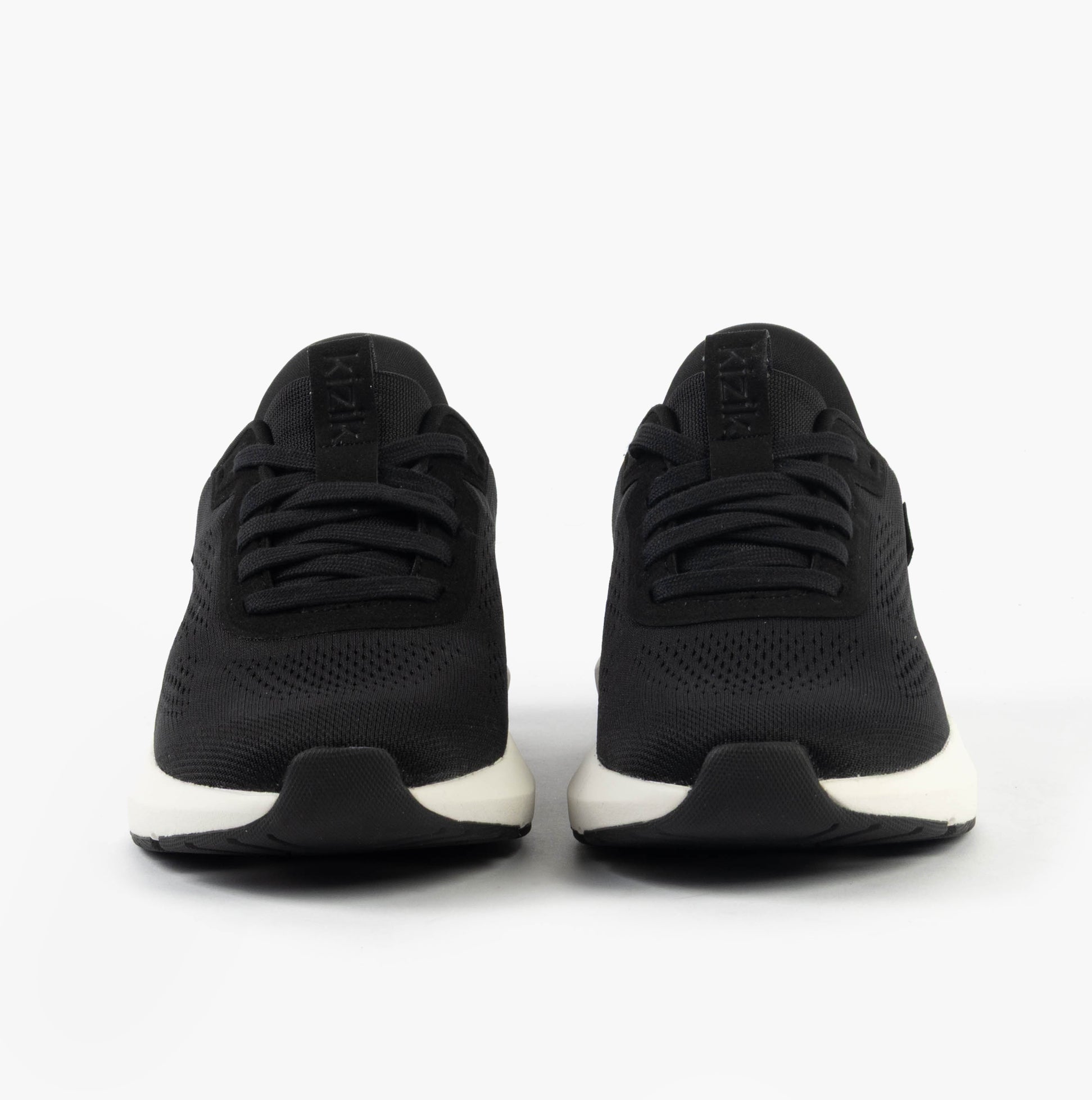 Kizik ATHENS 2.0 Womens Trainers Black front view showing lace-up design and round toe.