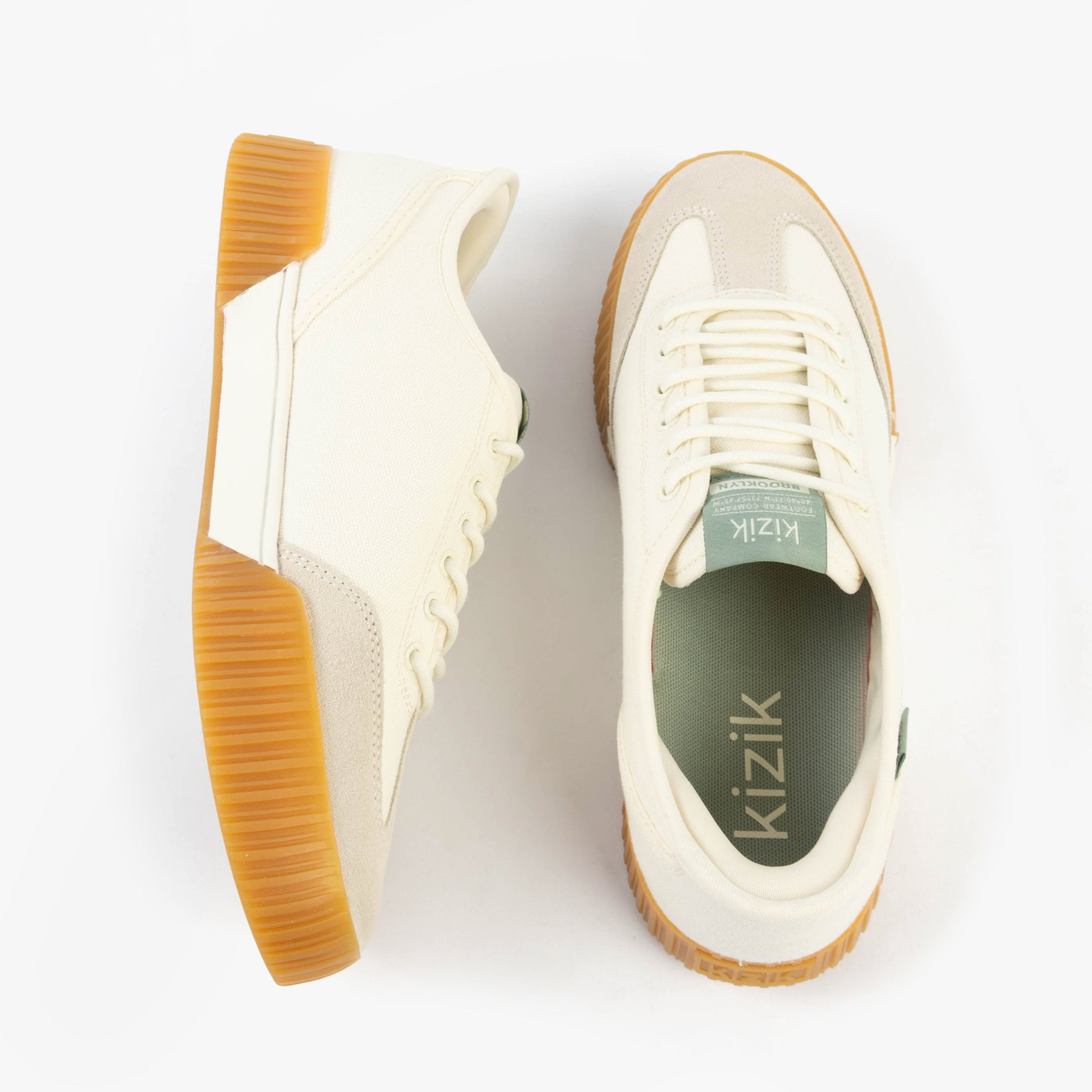 Kizik BROOKLYN Womens Trainers Pristine top view, showcasing light canvas upper and rubber sole.