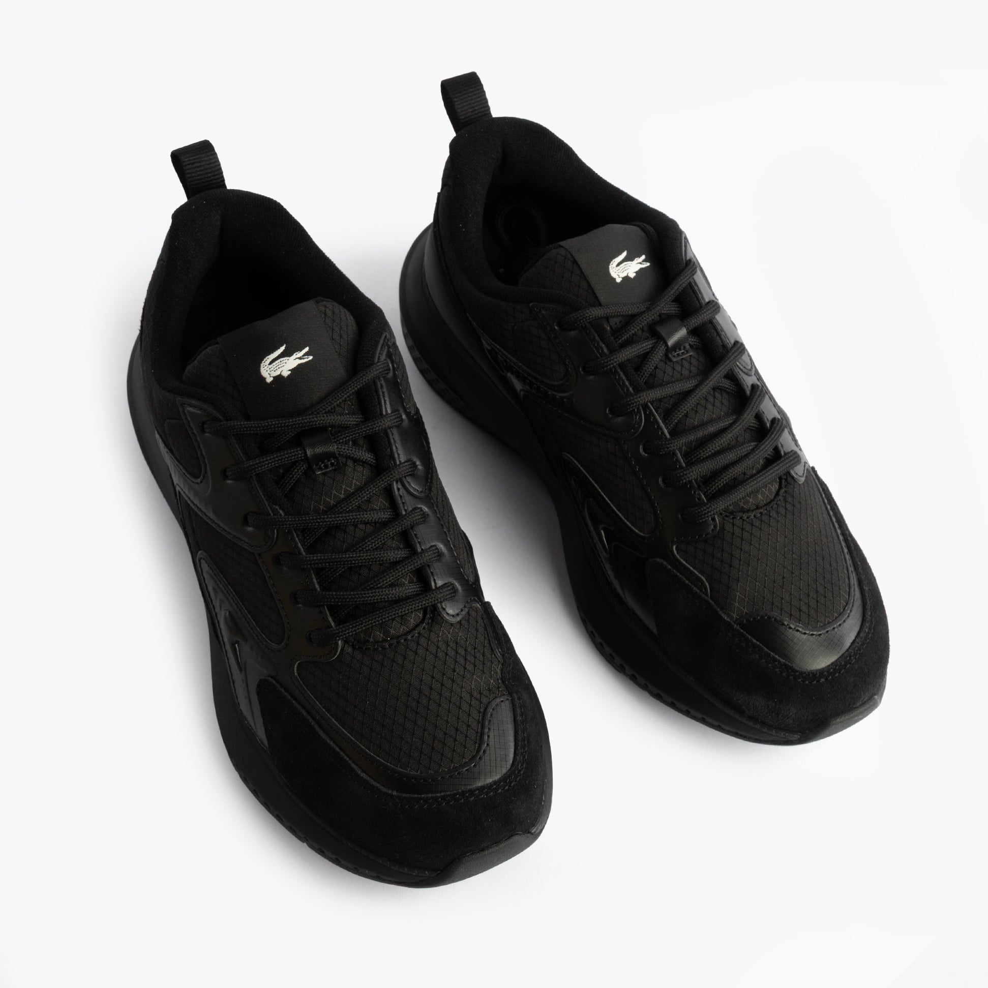 Lacoste L003 EVO Mens Performance Trainers Trainers Black top view showing mesh upper and lace-up design.