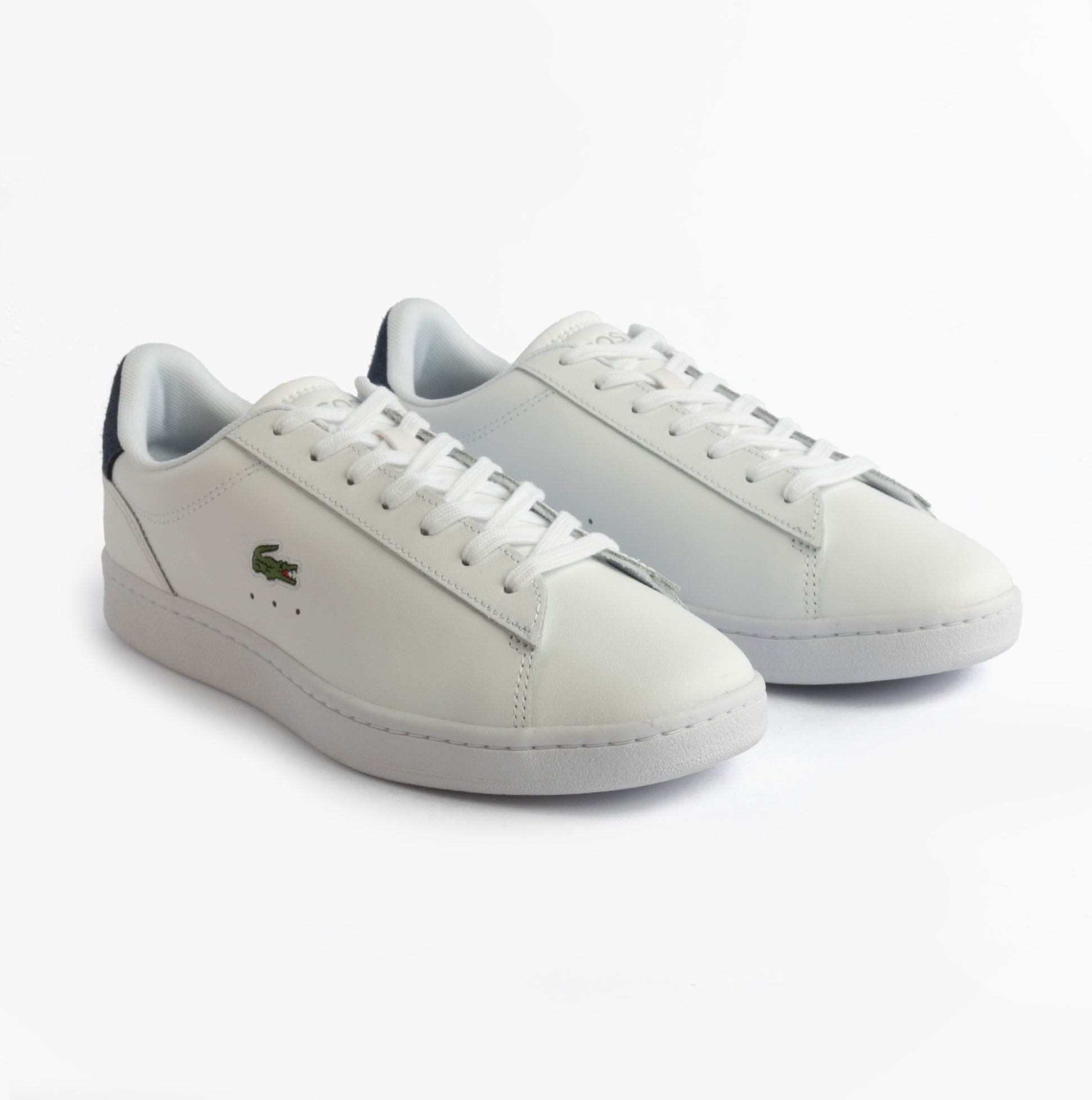 Lacoste CARNABY SET Mens Court Trainers Trainers White/Navy side view showcasing leather upper and lace-up closure.