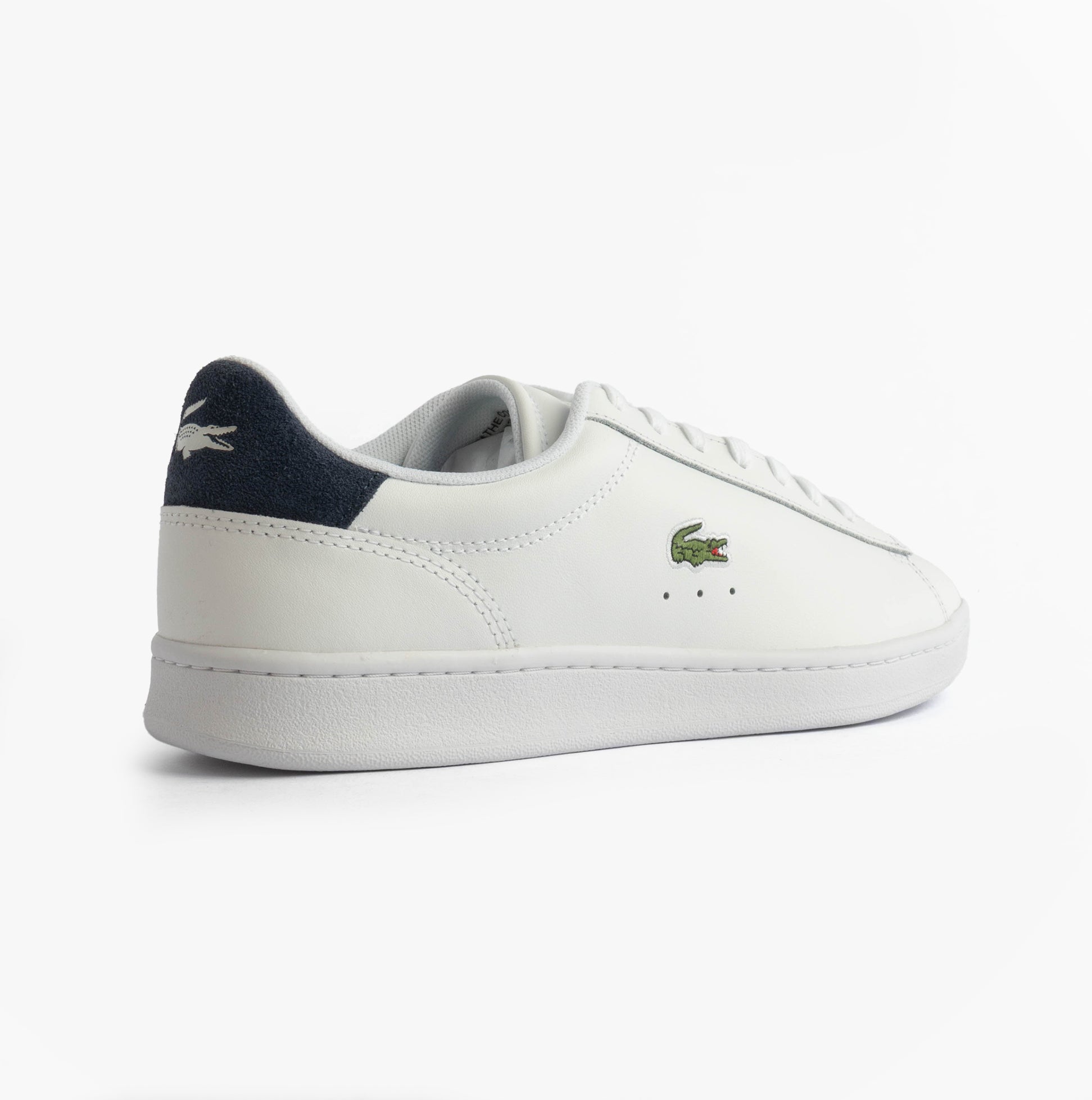 Lacoste CARNABY SET Mens Court Trainers Trainers White/Navy side view showcasing leather upper and rubber sole.