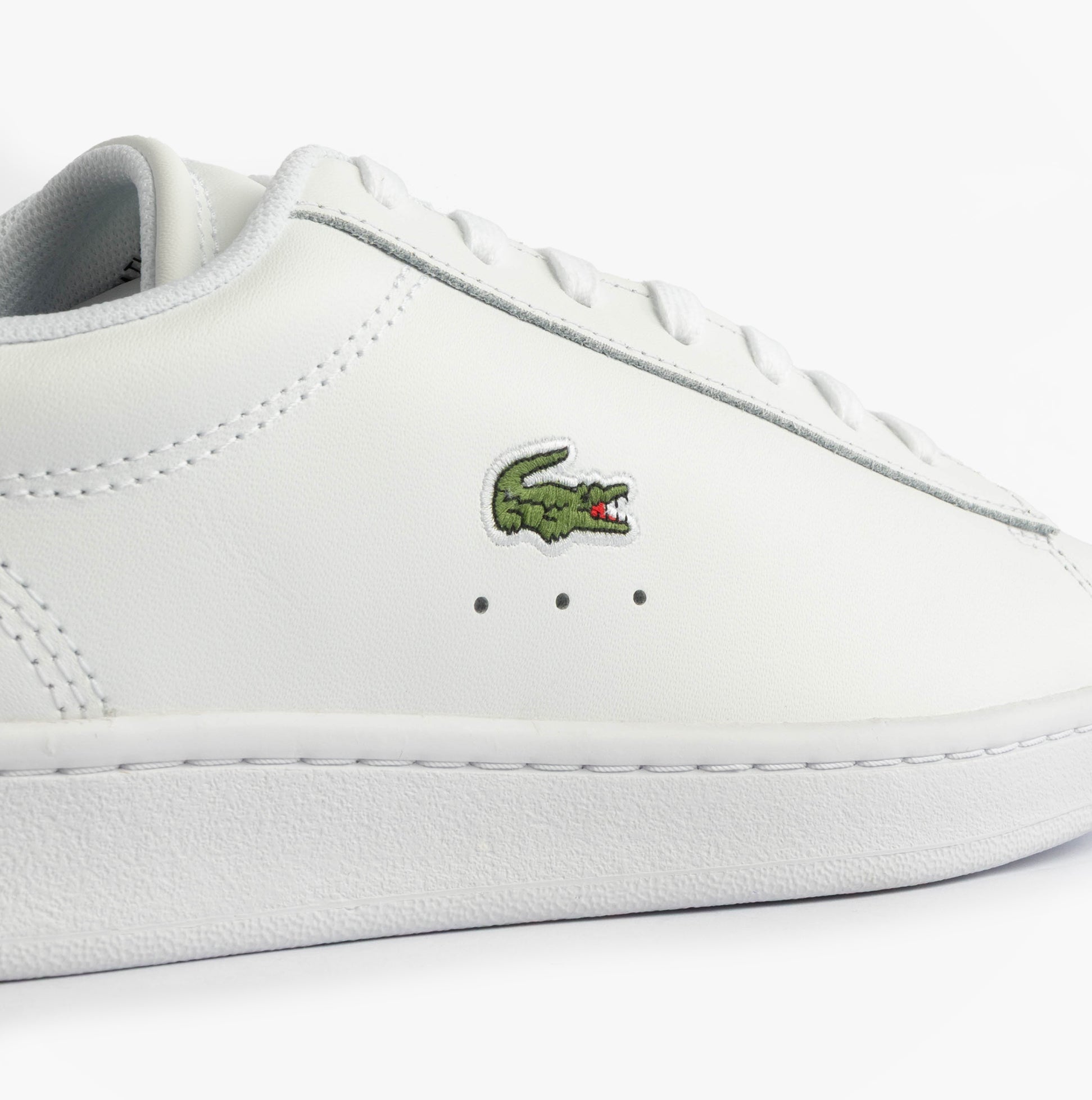 Lacoste CARNABY SET Mens Court Trainers Trainers White/Navy side view showing leather upper and iconic logo.