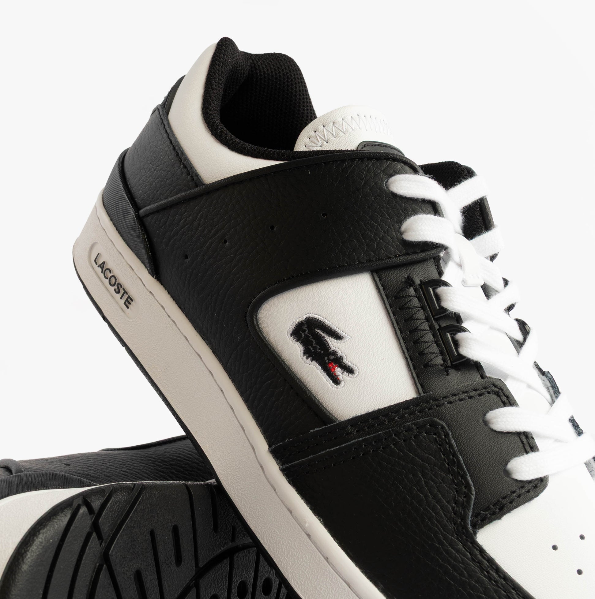 Lacoste COURT CAGE Mens Court Trainers Trainers Black/White detail view showcasing black leather upper and white sole.