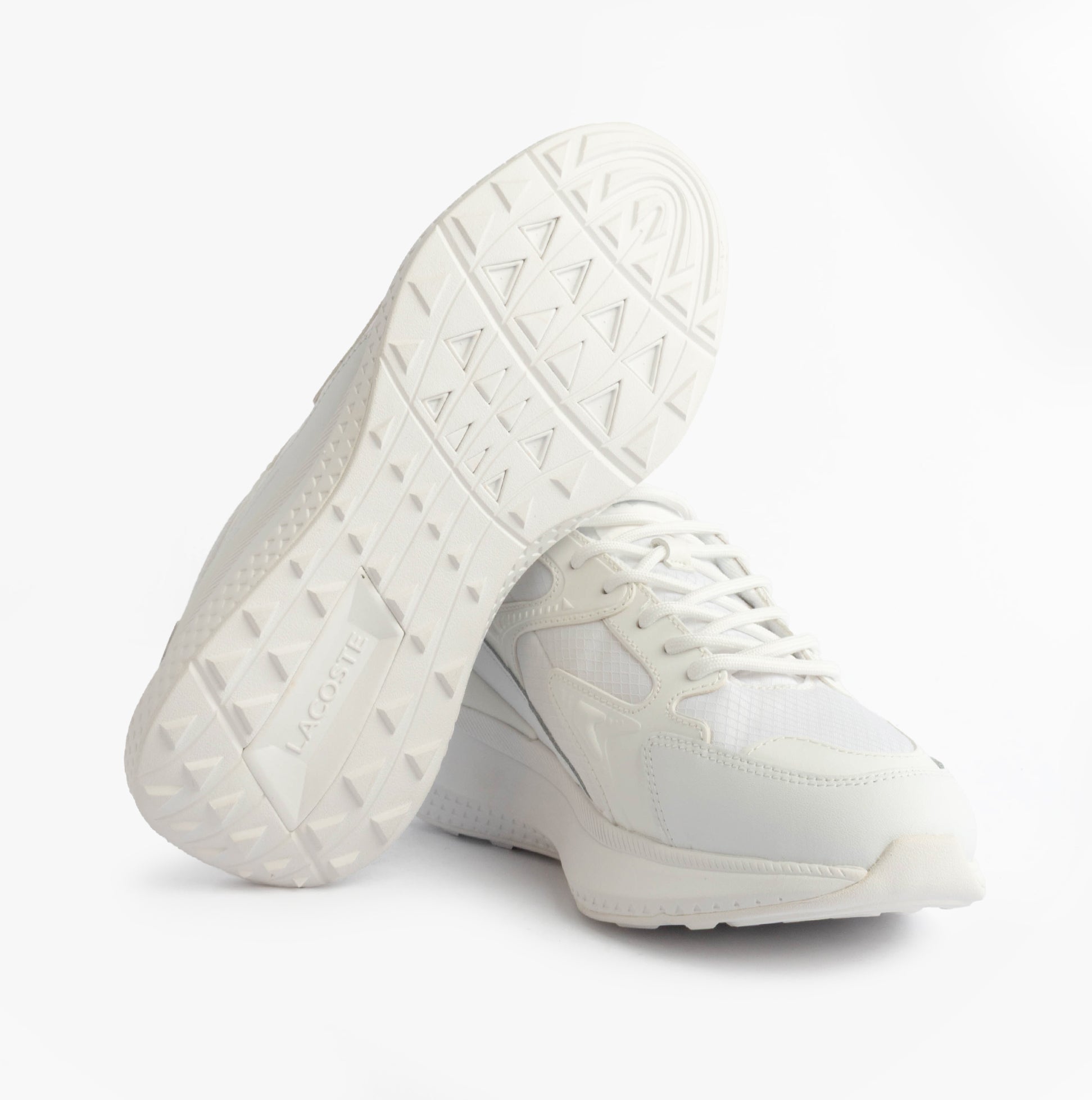 Lacoste L003 EVO Mens Performance Trainers Trainers White bottom view showcasing rubber sole and breathable leather/mesh upper.