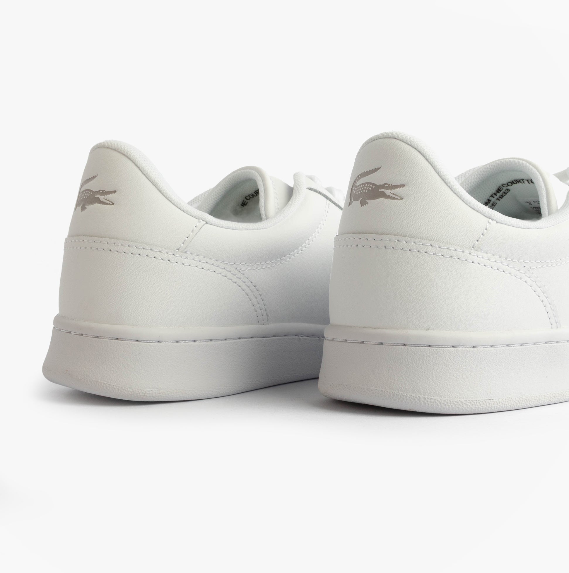 Lacoste CARNABY SET Mens Court Trainers Trainers White rear view showcasing the sleek leather design and logo detail.