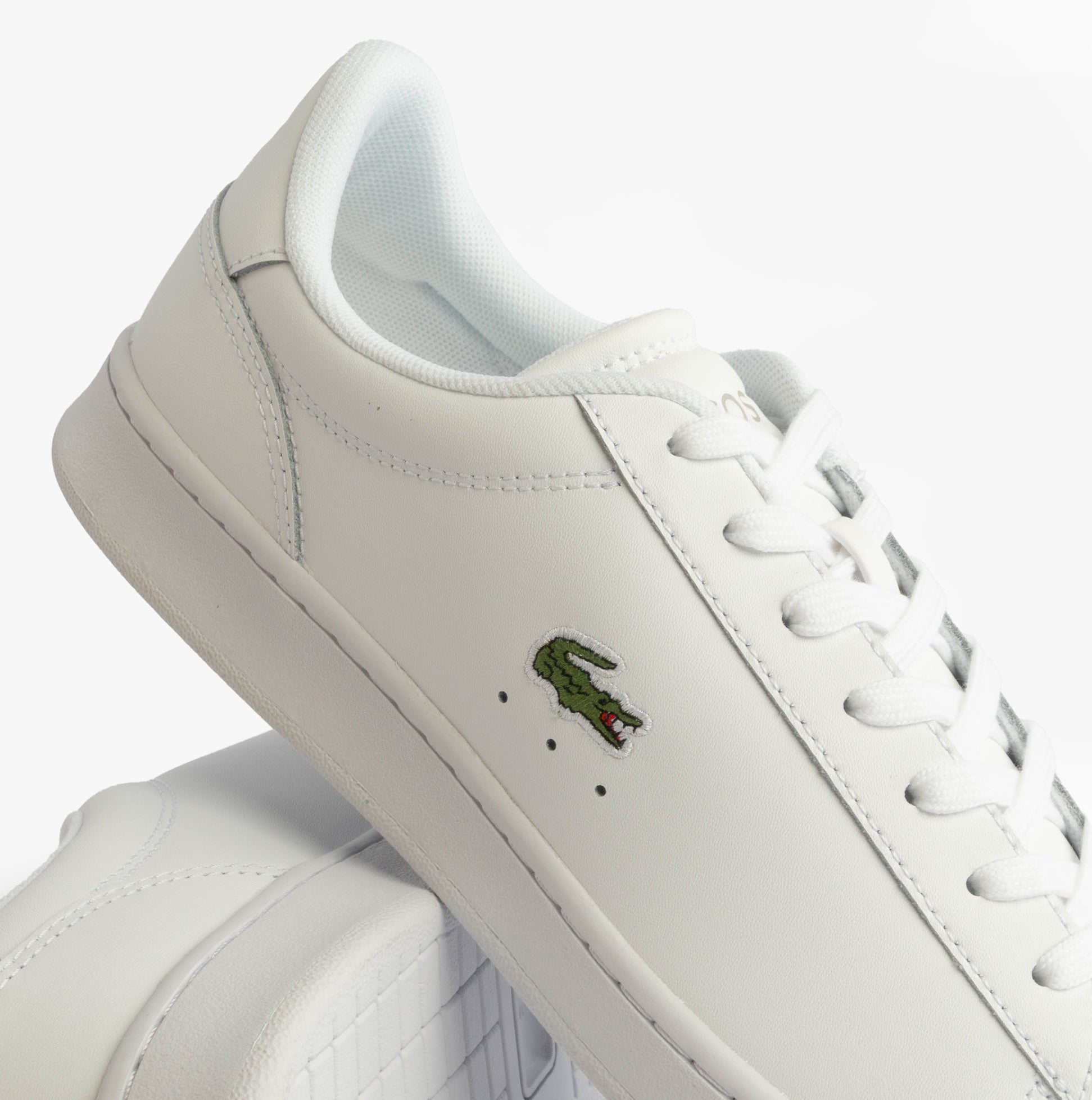 Lacoste CARNABY SET Mens Court Trainers Trainers White close-up side view with logo detail and lace-up design.