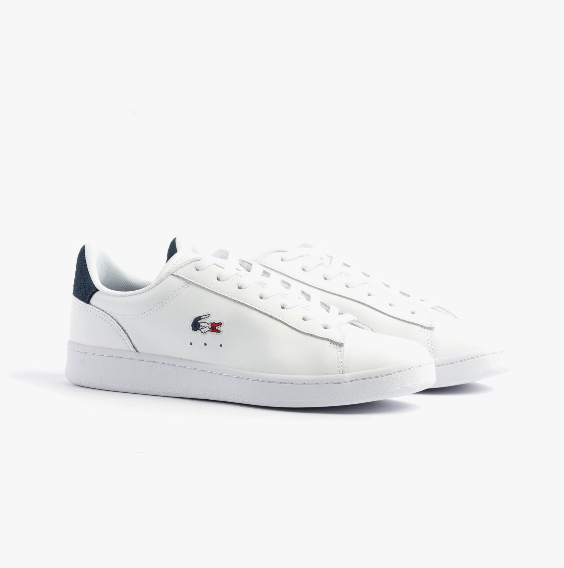 Lacoste CARNABY SET Mens Trainers White/Navy/Red side view showcasing leather upper and round toe design.