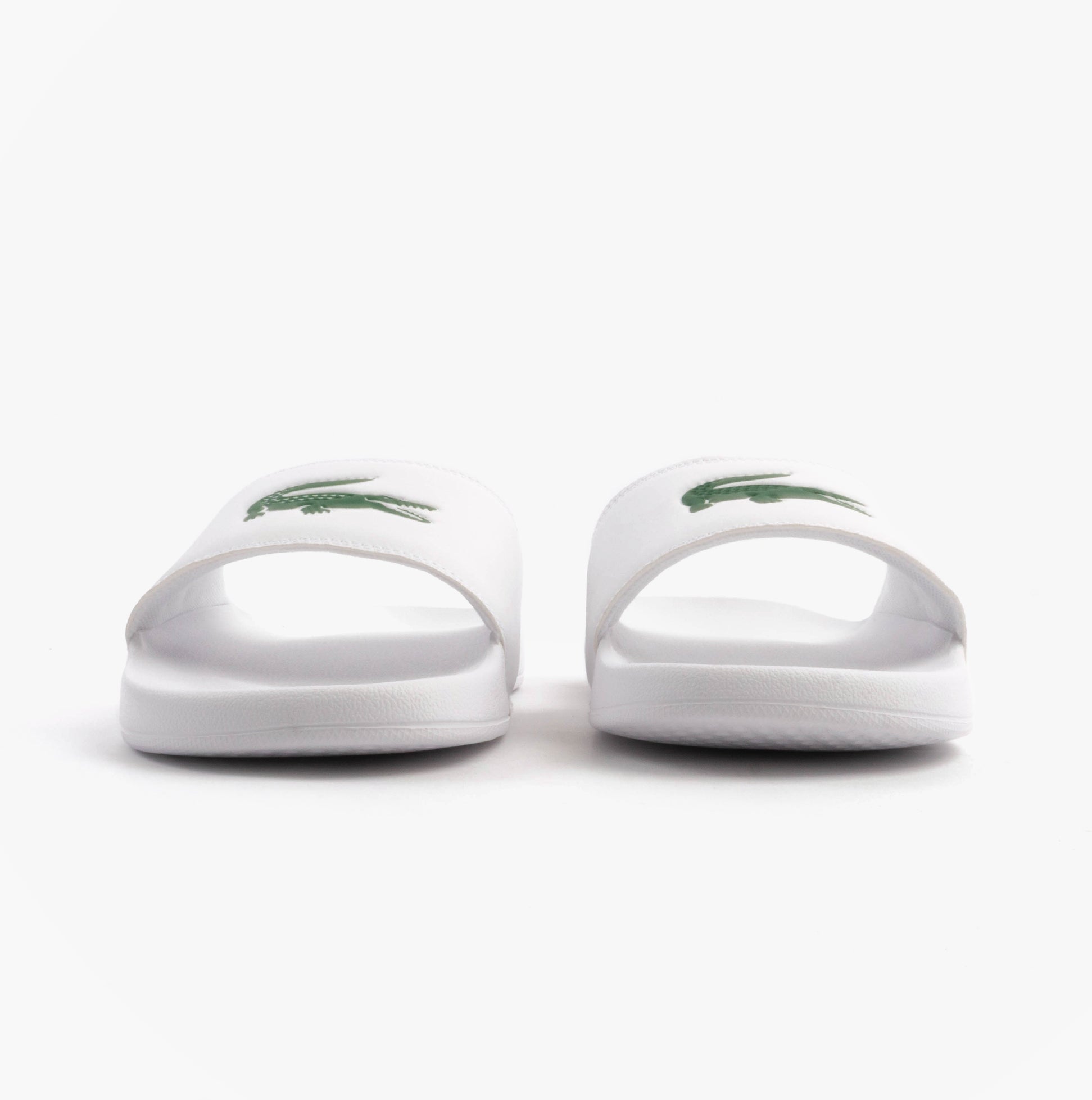 Lacoste SERVE SLIDE 0.0 Mens Slides White/Green front view showcasing comfortable slip-on design.