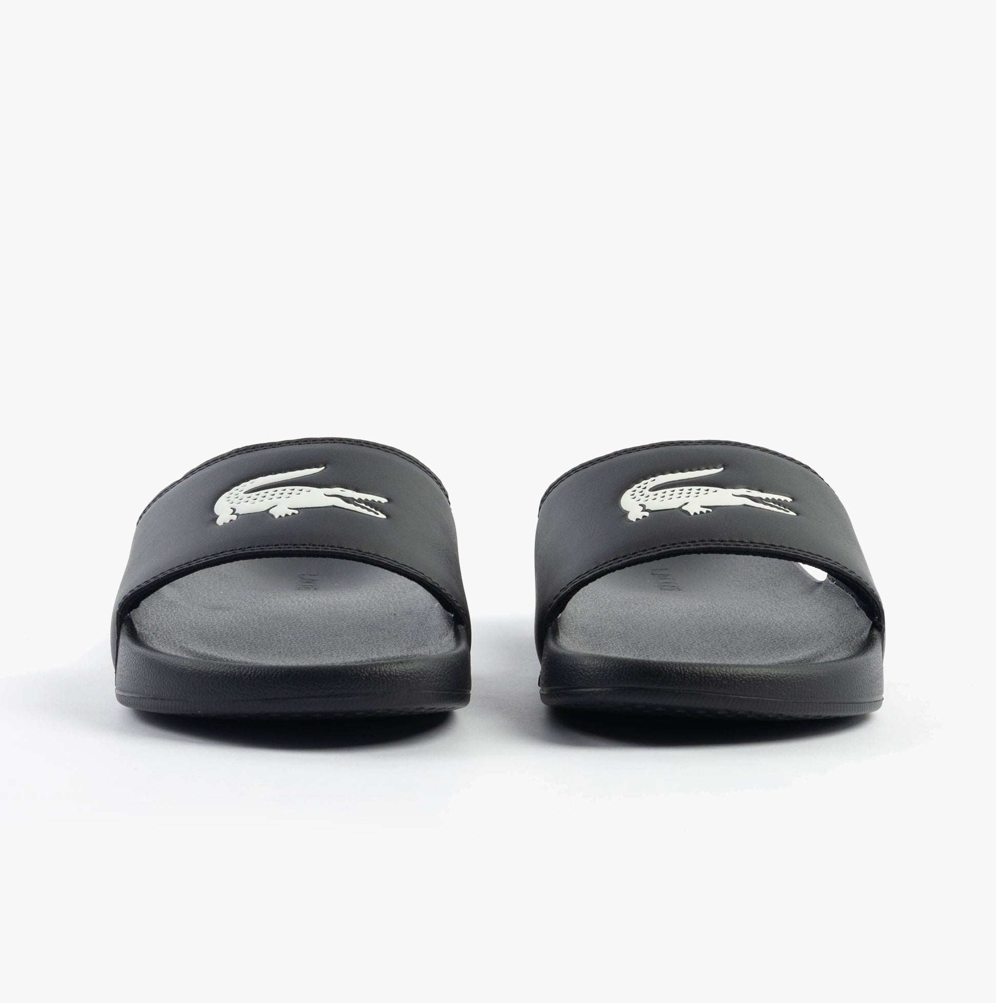 Lacoste SERVE SLIDE 0.0 Mens Slides Black/White front view showcasing the comfortable slip-on design.