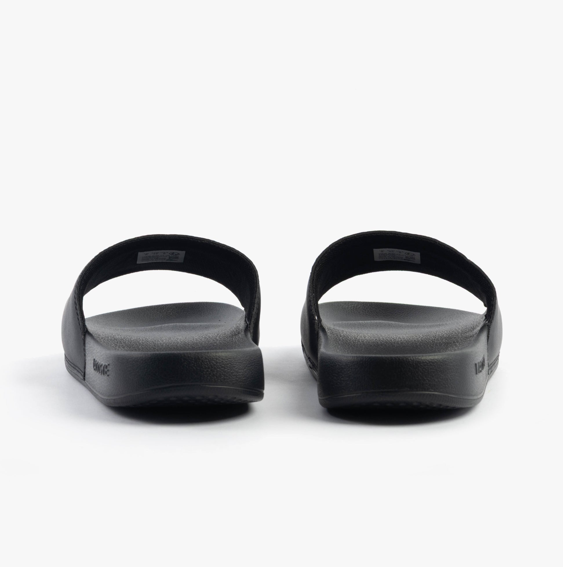 Lacoste SERVE SLIDE 0.0 Mens Slides Black/White rear view showcasing the slip-on design and EVA material.