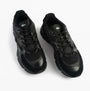 Lacoste L003 NEO Mens Trainers Black top view showcasing lace-up design and leather material.