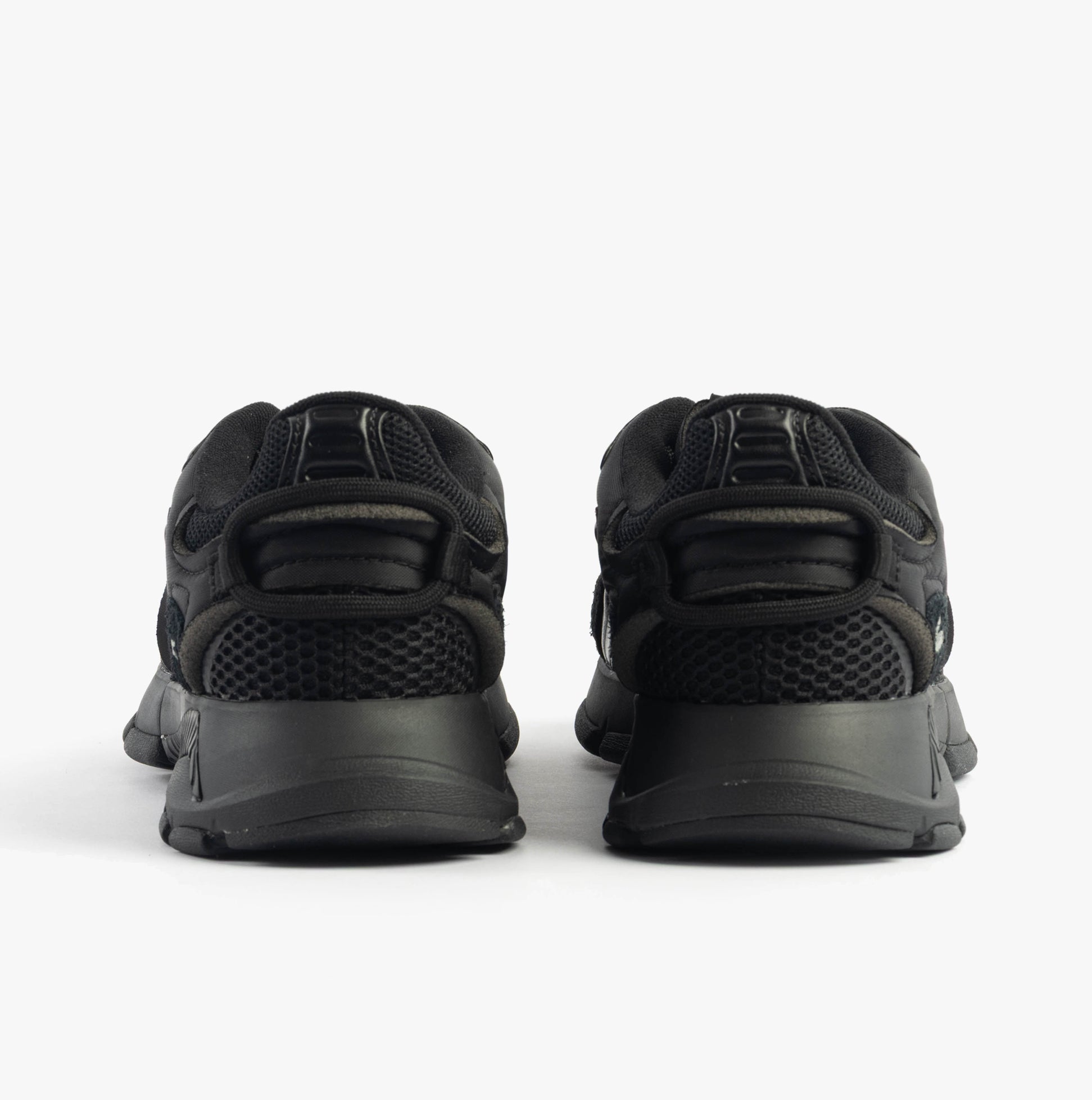 Lacoste L003 NEO Mens Trainers Black rear view showing sleek design and low top style.