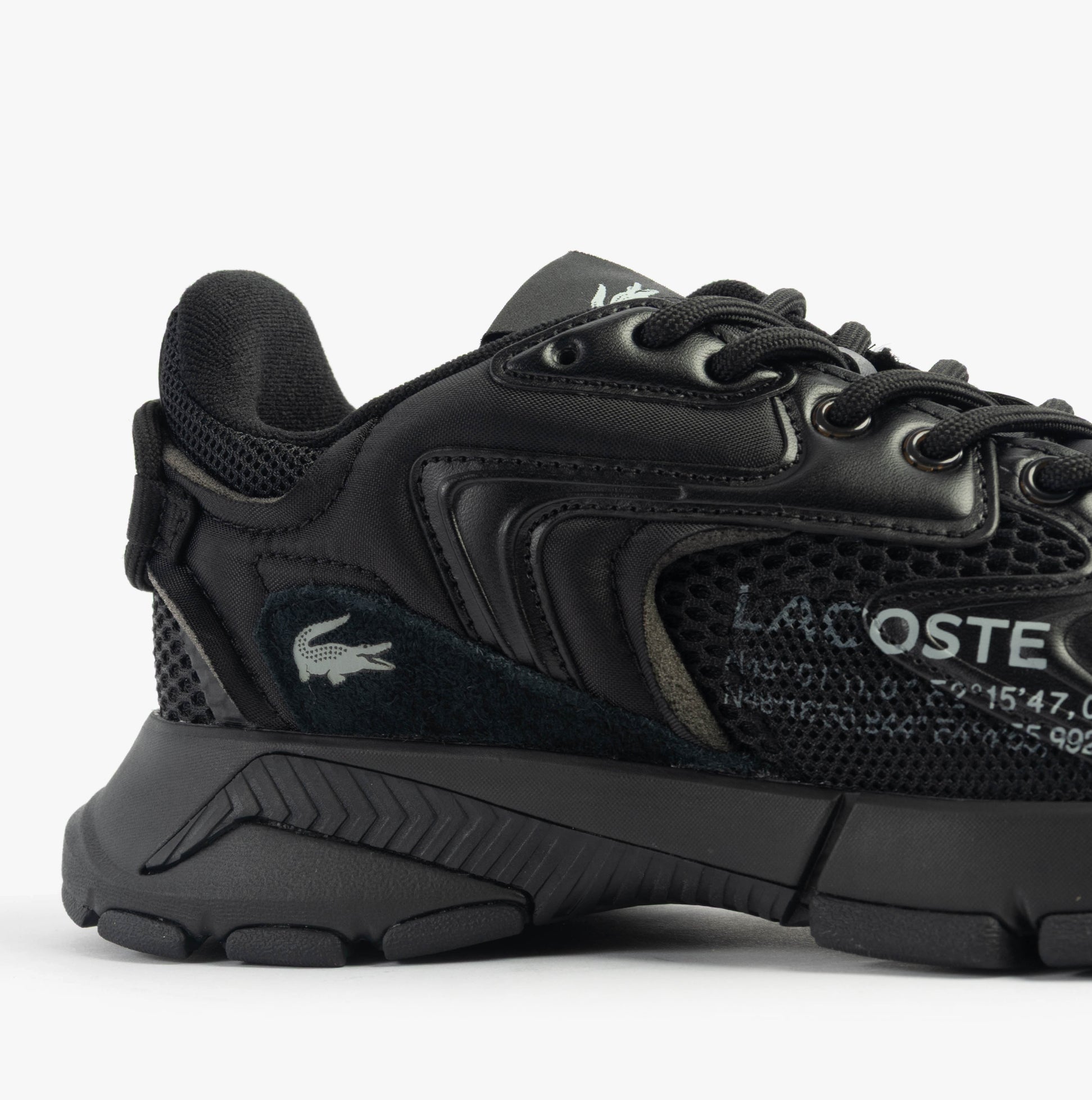 Lacoste L003 NEO Mens Trainers Black side view showing leather upper and lace-up closure.