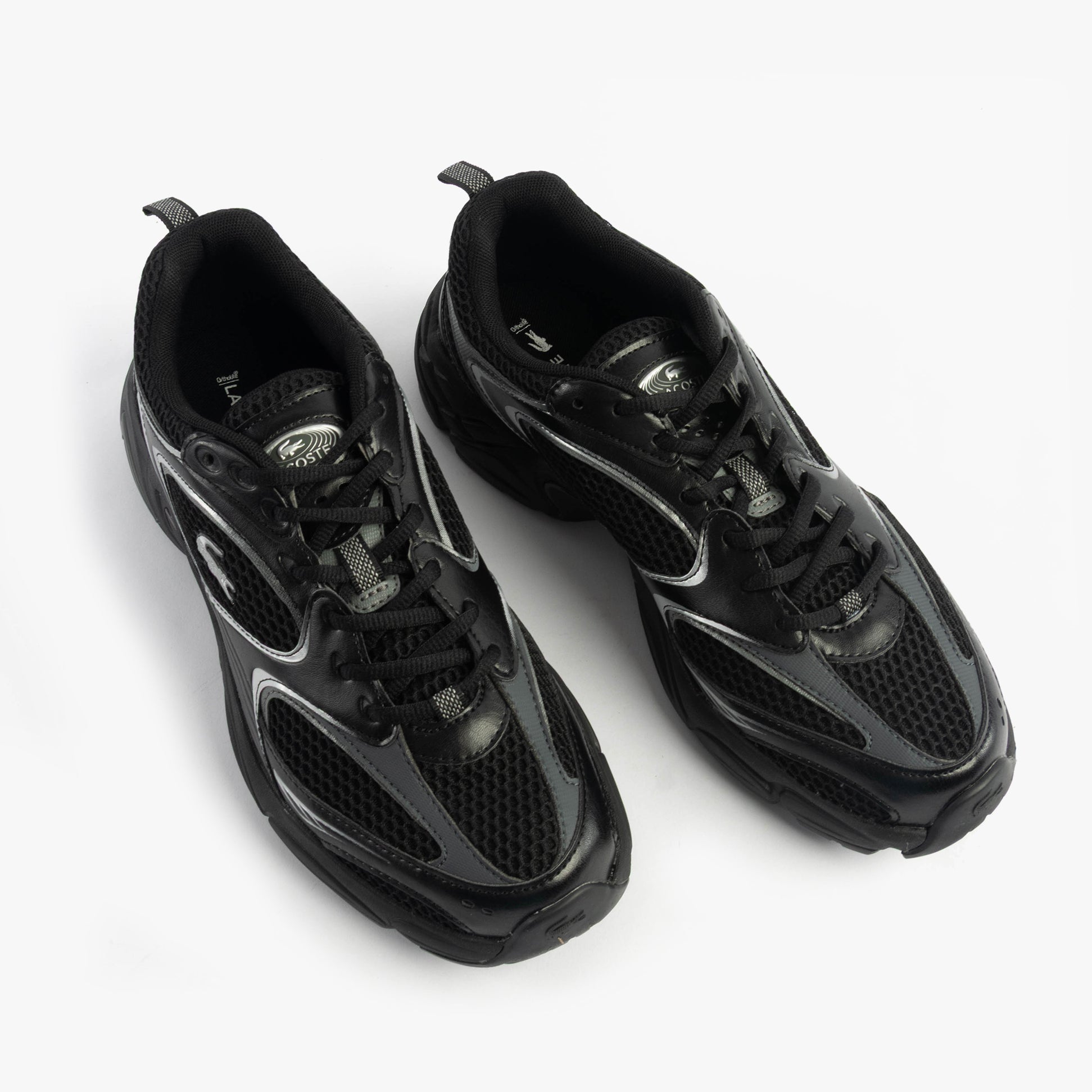 Lacoste STORM 96 2K Mens Trainers Black top view showing the casual leather and polyester design.