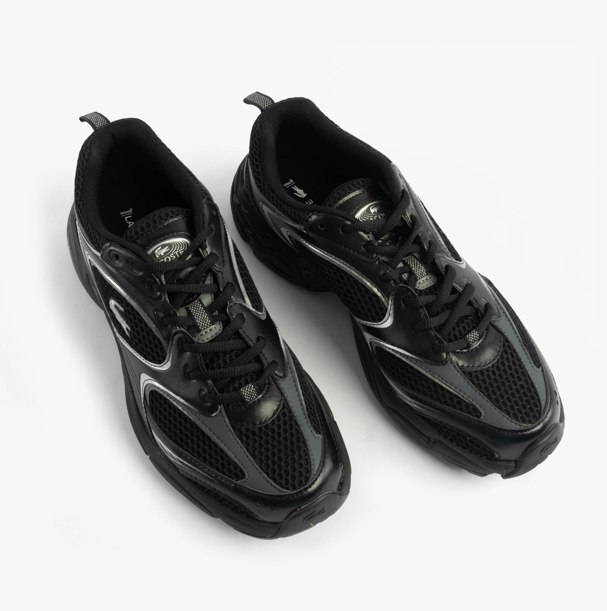 Lacoste STORM 96 2K Mens Trainers Black top view showing the casual leather and polyester design.