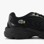 Lacoste STORM 96 2K LITE Mens Trainers Black side view showcasing black mesh and leather upper with brand logo.