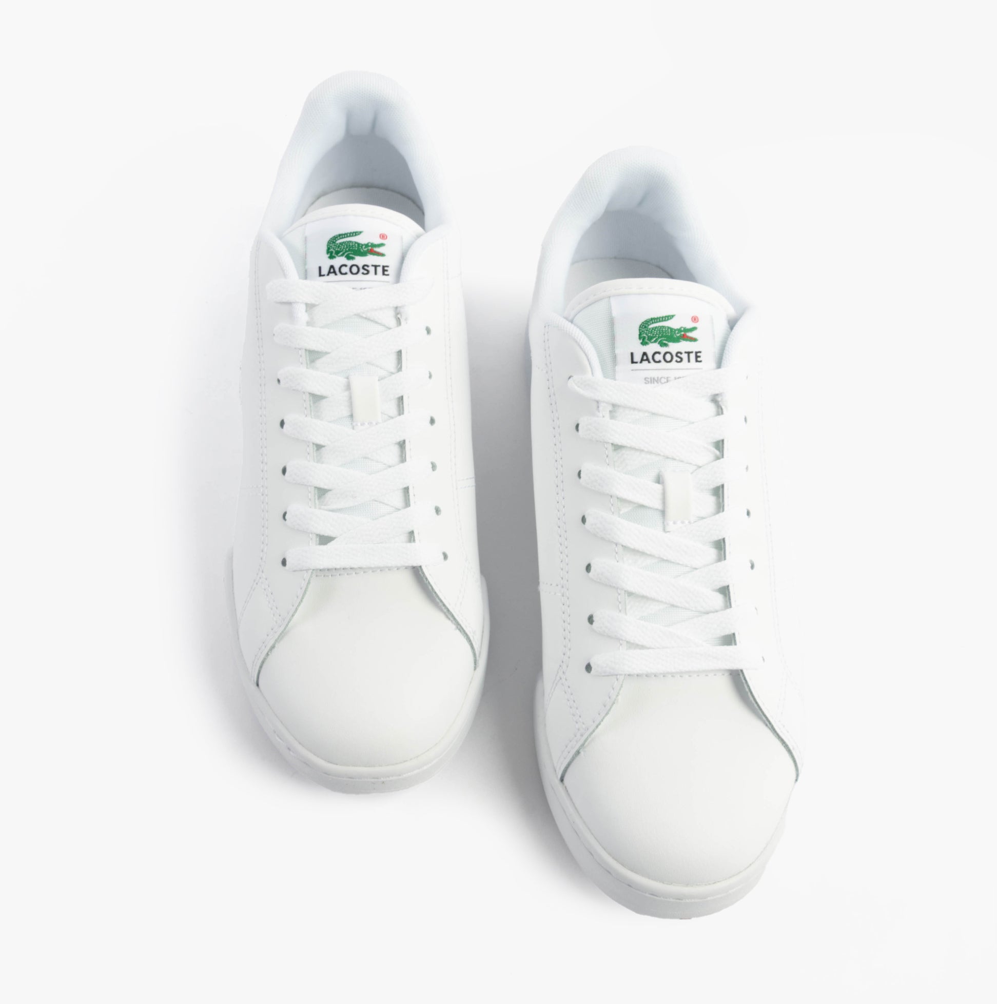Lacoste CARNABY CUP Mens Trainers White top view showcasing lace-up closure and round toe design.