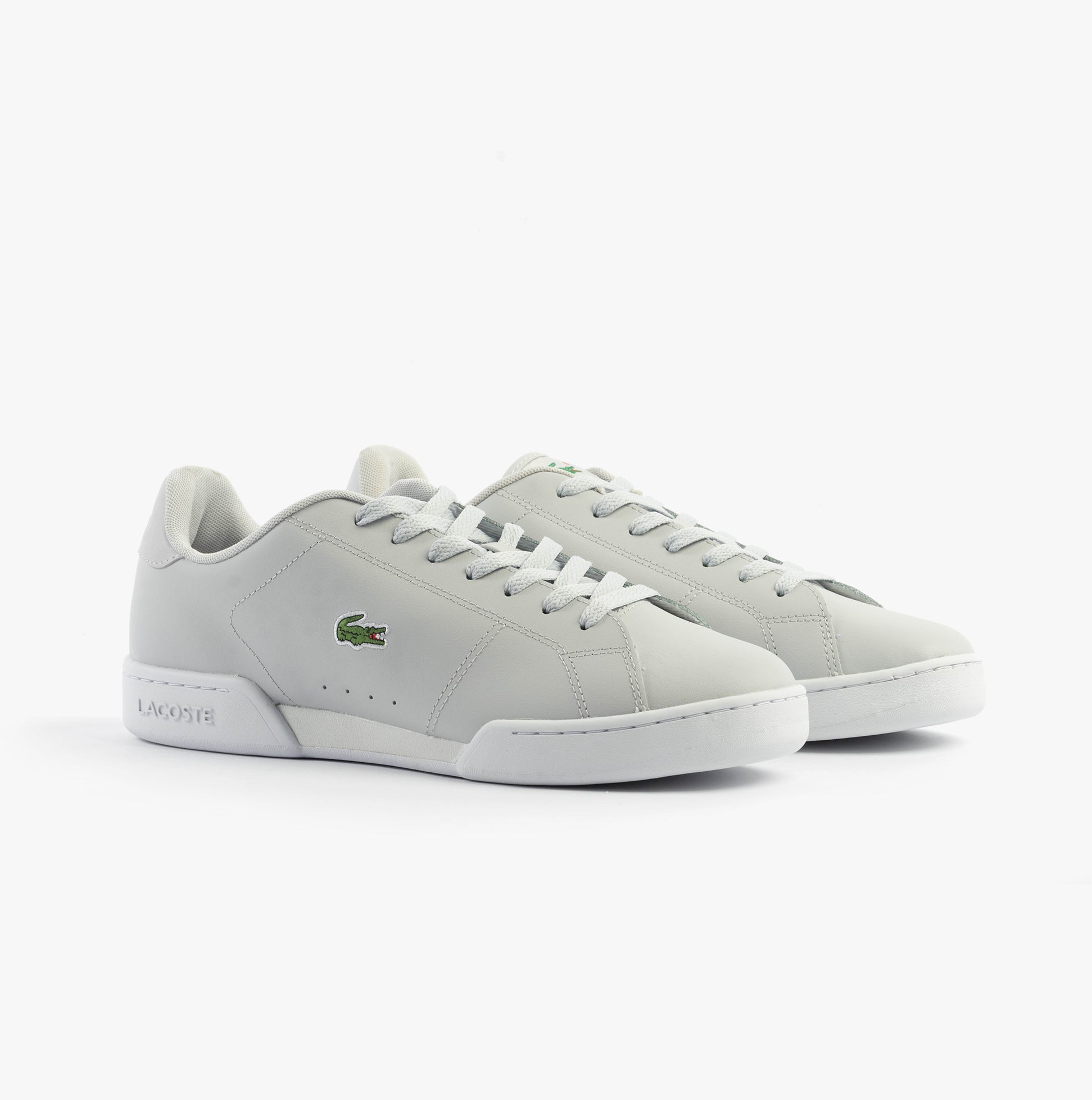 Lacoste CARNABY CUP Mens Trainers Light Grey/White side view showing lace-up design and low-top silhouette.