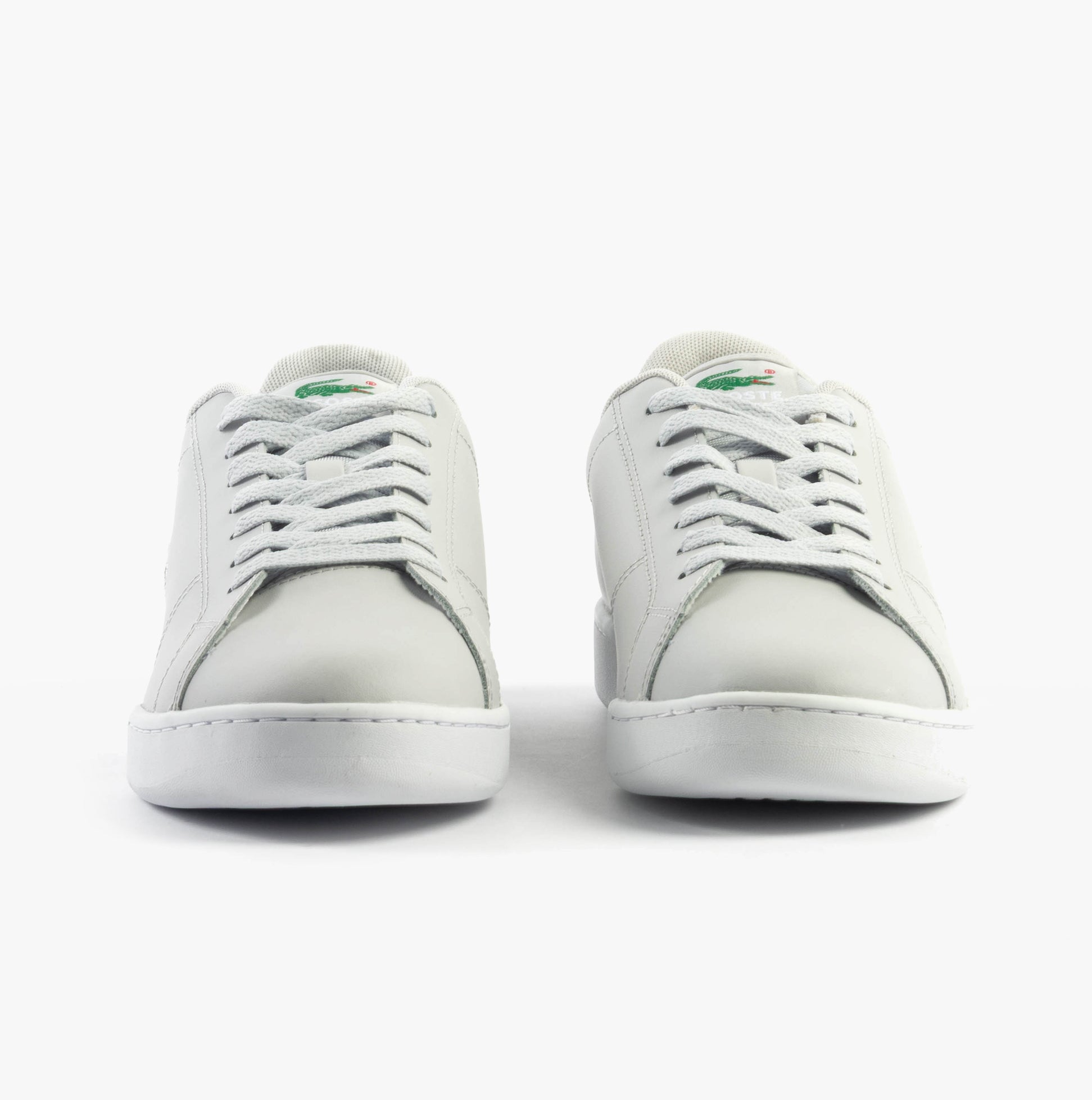 Lacoste CARNABY CUP Mens Trainers Light Grey/White front view showcasing lace-up design and round toe shape.