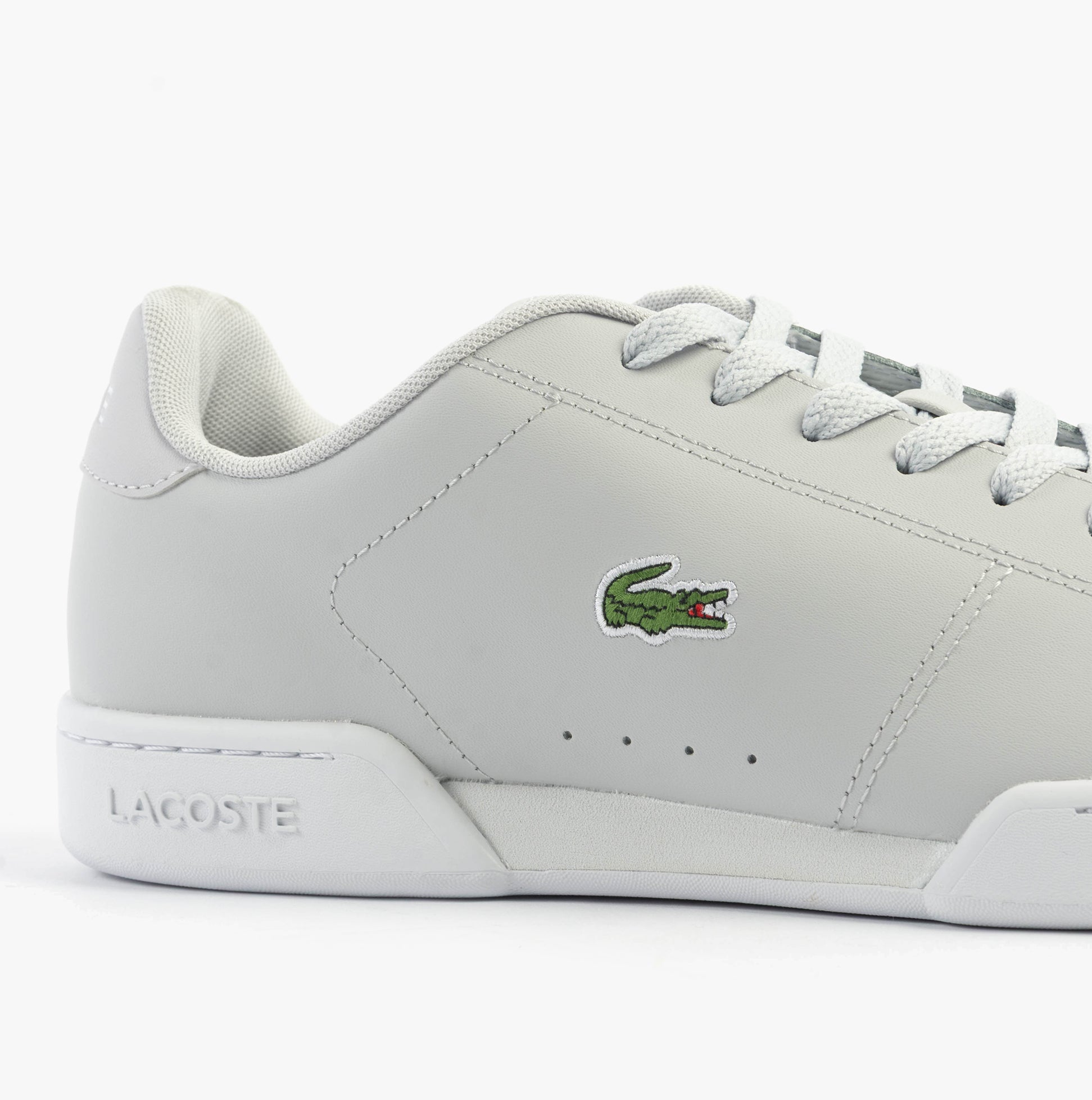 Lacoste CARNABY CUP Mens Trainers Light Grey/White side view showcasing leather upper and logo.