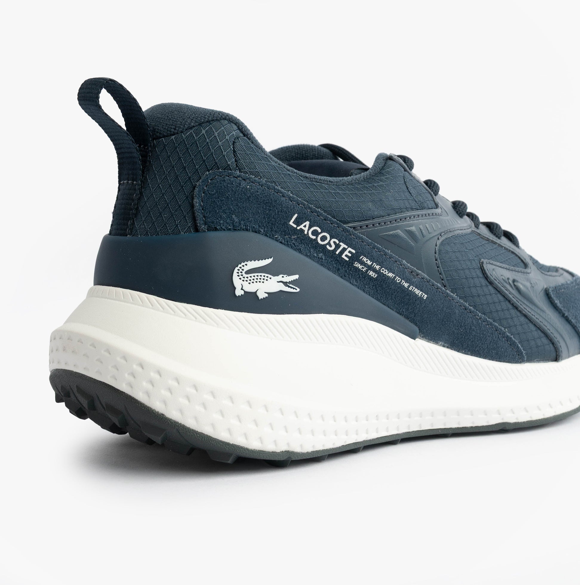 Lacoste L003 EVO Mens Performance Trainers Trainers Navy/White side view showing heel detail and logo.