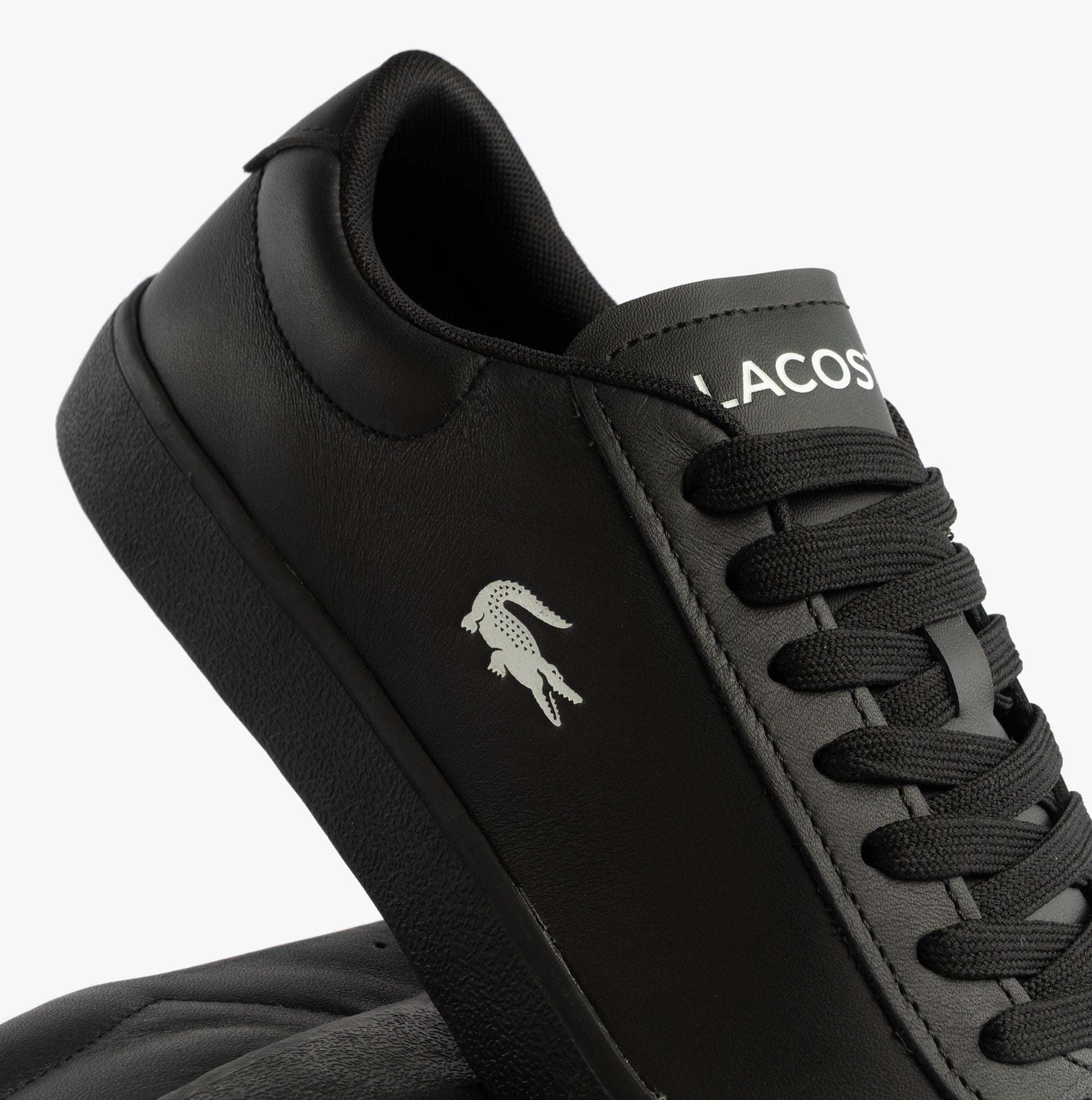 Lacoste BASESHOT EVO Mens Court Trainers Trainers Black detail view showcasing the shoe's leather upper and lace-up closure.