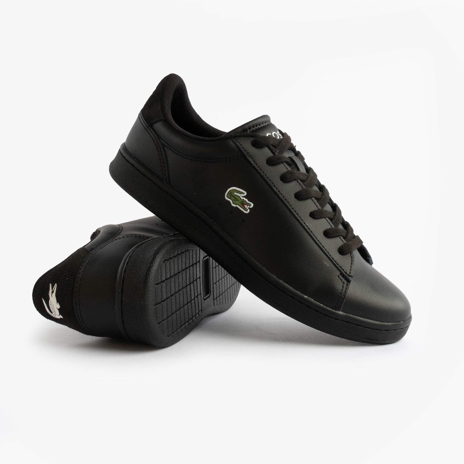 Lacoste CARNABY SET Mens Court Trainers Trainers Black side view showcasing leather upper and rubber sole.