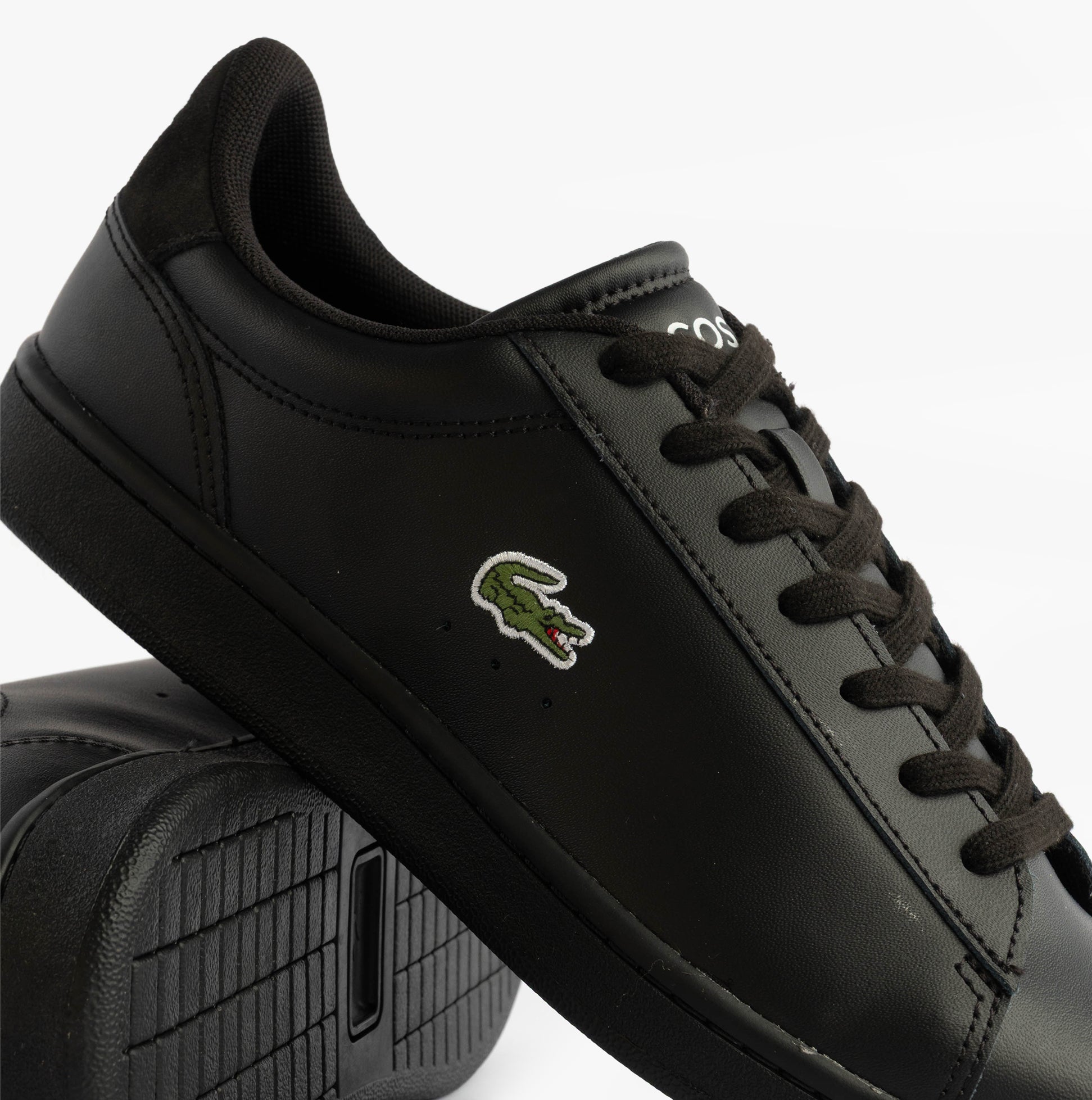 Lacoste CARNABY SET Mens Court Trainers Trainers Black side view showcasing leather upper and iconic logo.