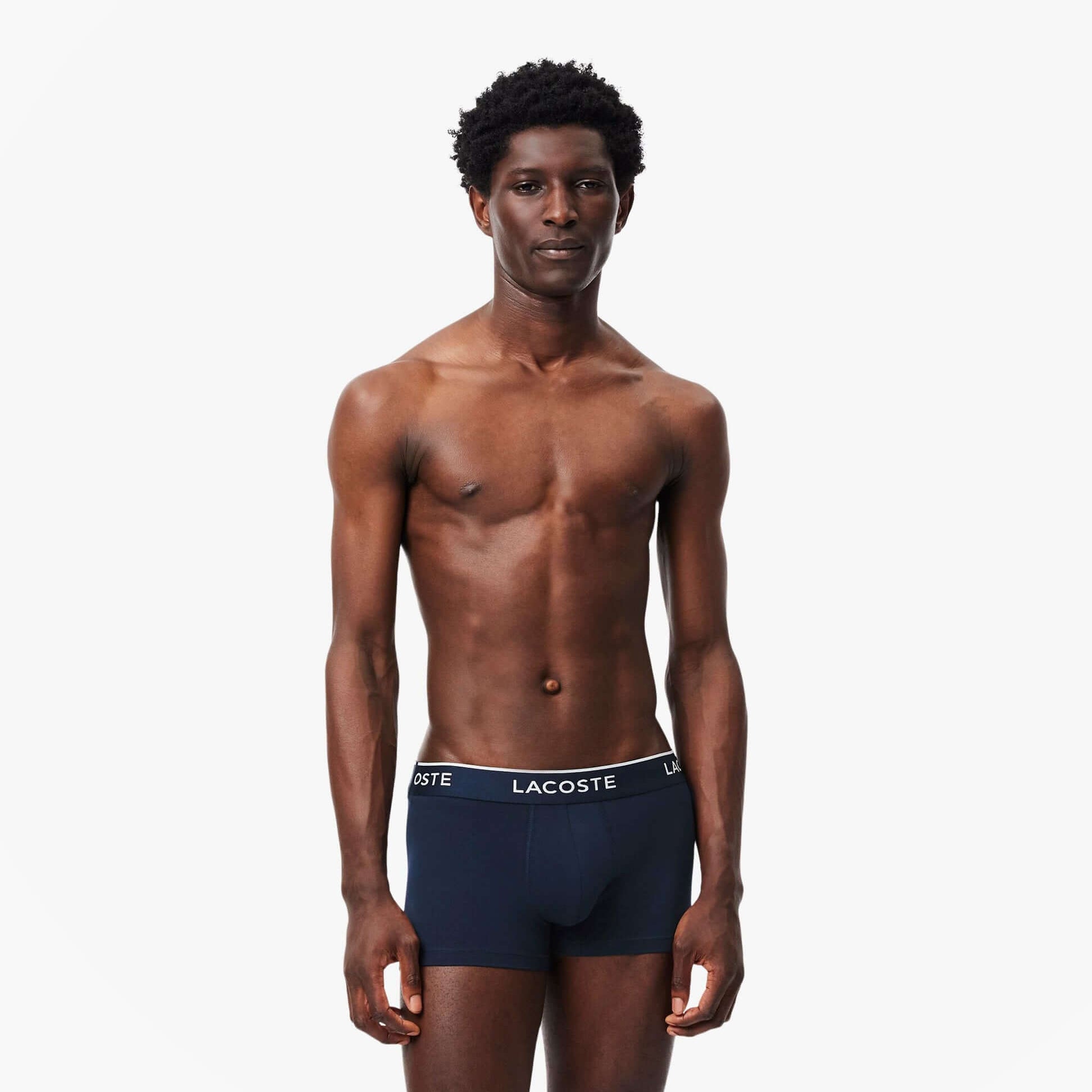 Lacoste 3 Pack Trunks Mens Trunks Navy Blue/Green/Red/Navy Blue front view on model, showcasing navy blue underwear.