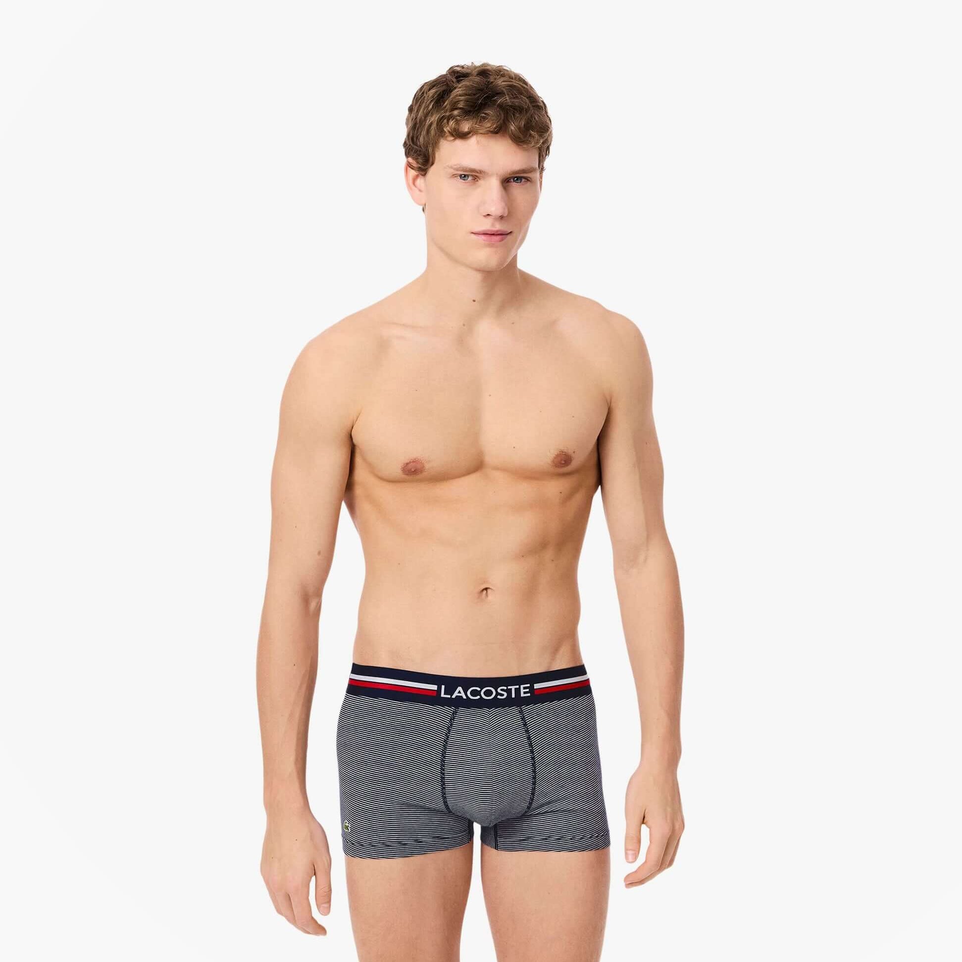Lacoste 3 Pack Trunks Mens Trunks Navy Blue/White front view on model showcasing design and fit.